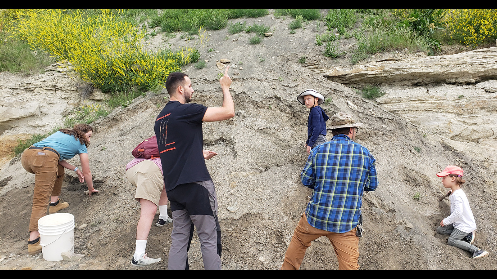 Dean Lomax explains what a spoil pile is. Bones are often missed along the way, so the spoil pile has to be sorted through to ensure nothing important has been left behind while digging for fossils.