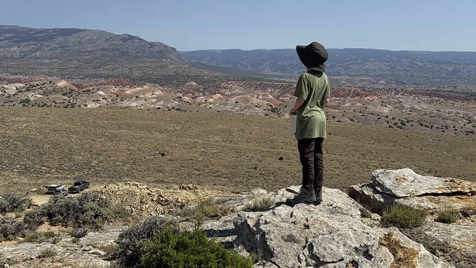 Nico Able, 11, contemplates the millions of years of prehistoric time stretched out across the Bighorn Basin during the Children's Museum of Indianapolis's Family Dino Dig at the Jurassic Mile.