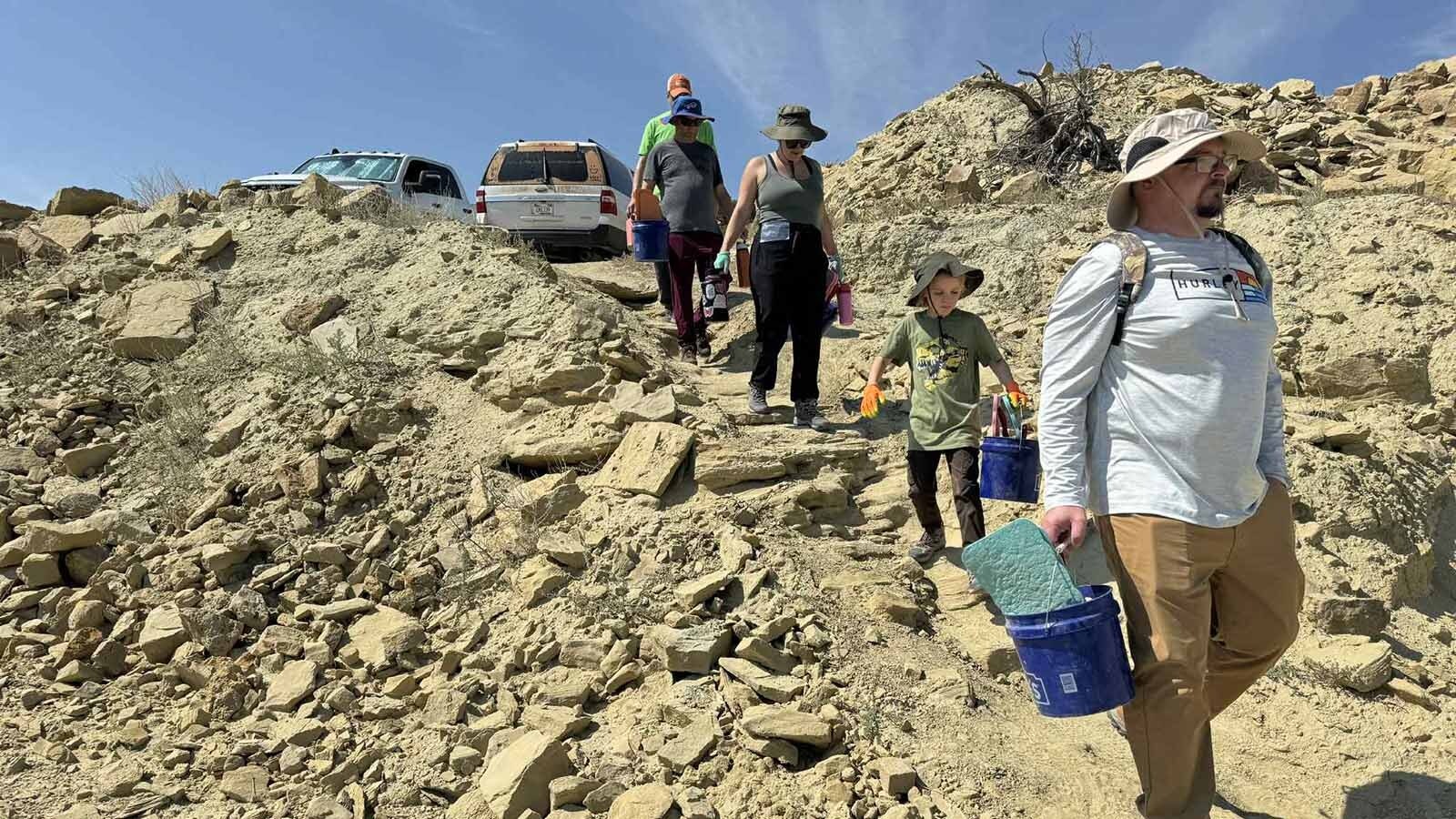 Family Dino Dig participants descend the “Grand Staircase" into the Lower Sauropod Quarry for a day of dinosaur digging on the Jurassic Mile.