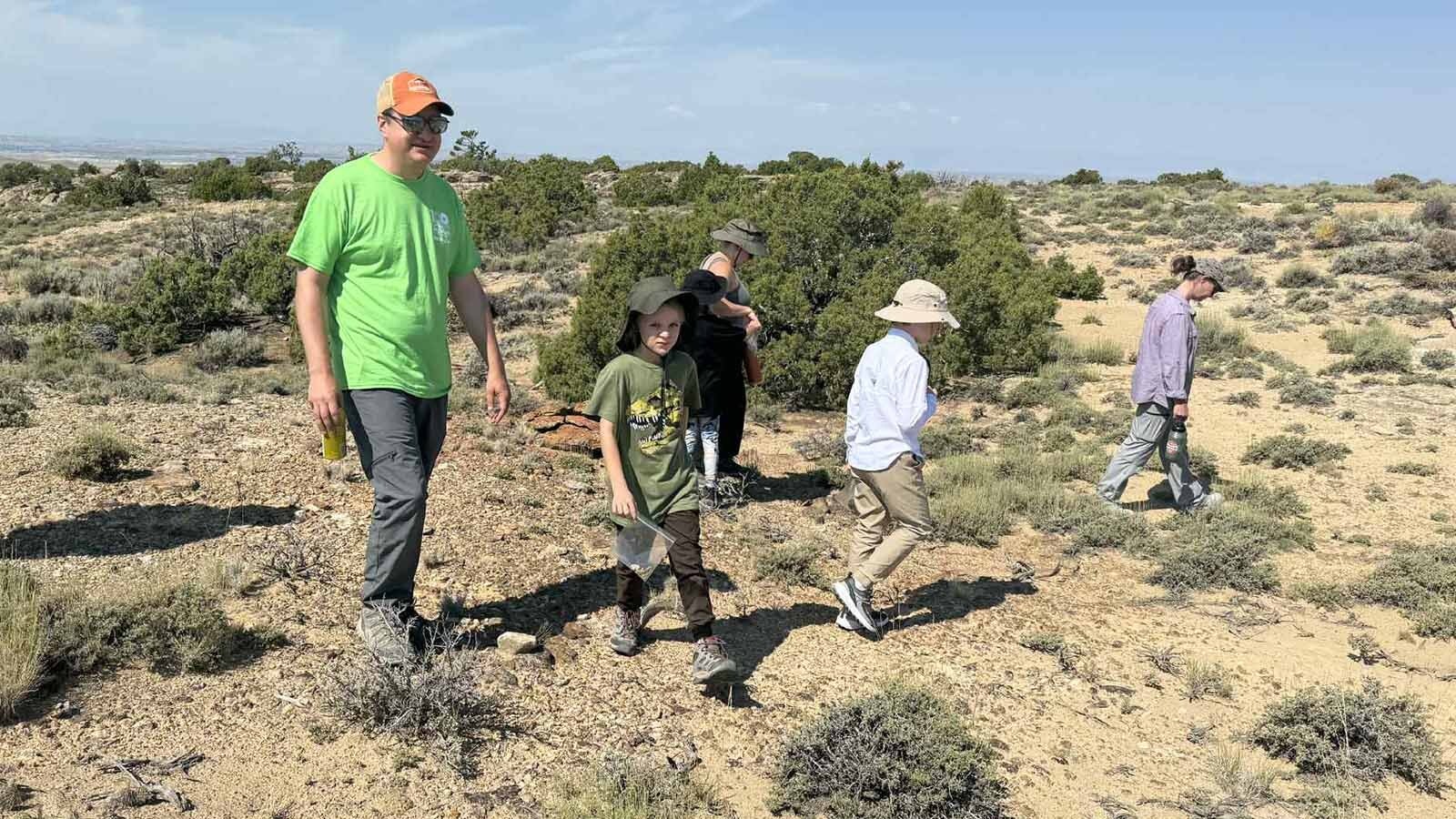 “Dr. Joe” Frederickson leads participants in the Children's Museum of Indianapolis's Family Dino Dig on a short fossil prospecting hike on the Jurassic Mile near Cowley.