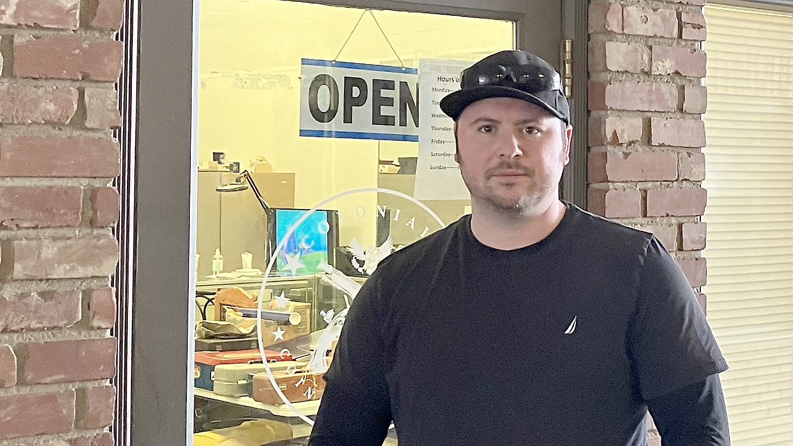 Justin Wayne Foster, owner of Colonial Coins and Currency, is accused of faking a robbery to steal a coin collection worth between $80,000 and $100,000.