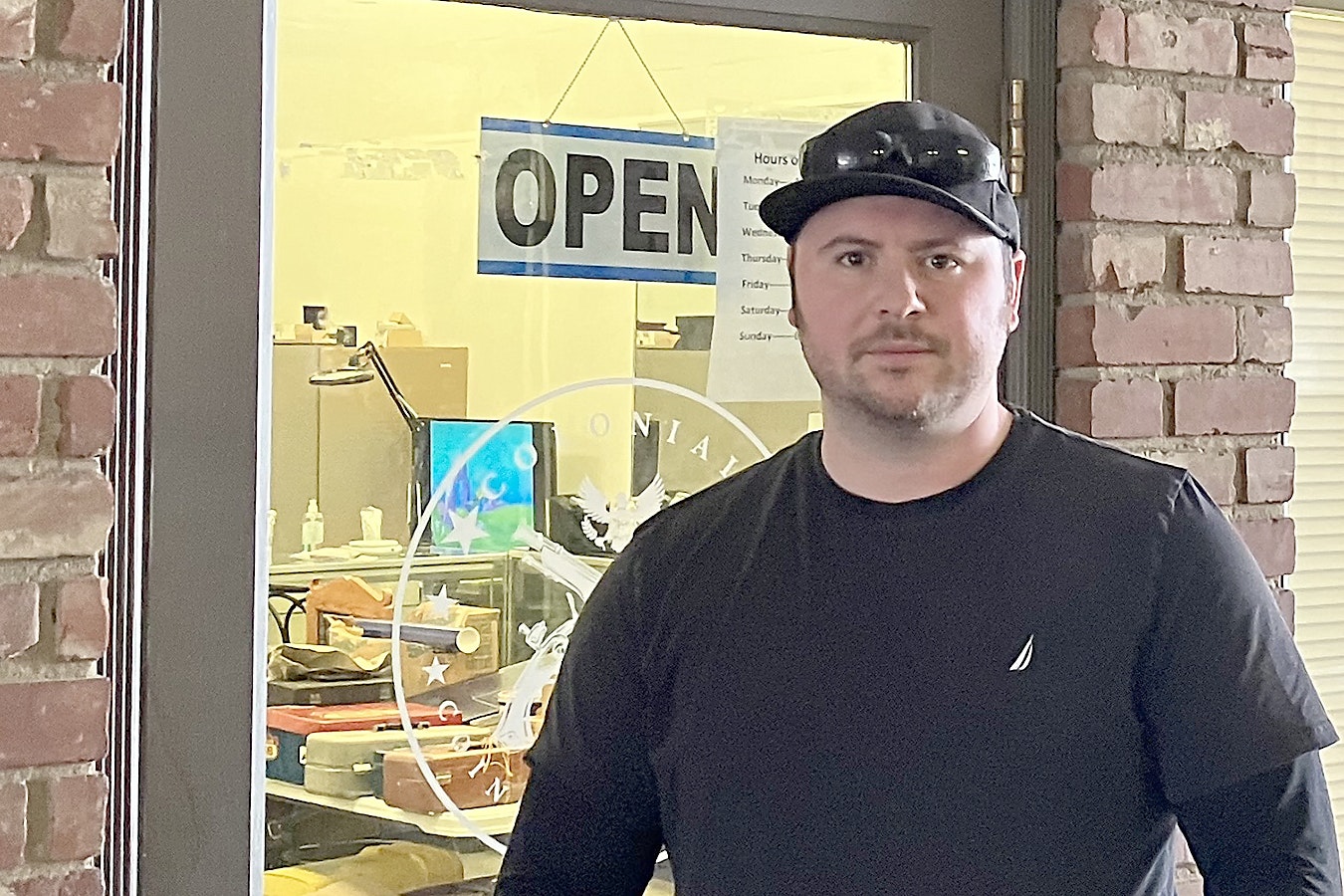 Justin Foster, owner of Colonial Coins & Currency in Casper, said accusations he conspired to steal a customer's $100,000 coin collection "destroyed my business." Charges against him have been dropped.