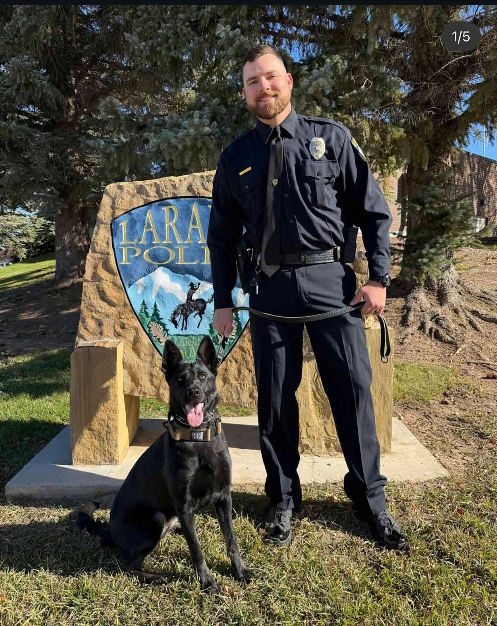 Officer Seth Meyer and K-9 Zara pose outside the Laramie Police Department.