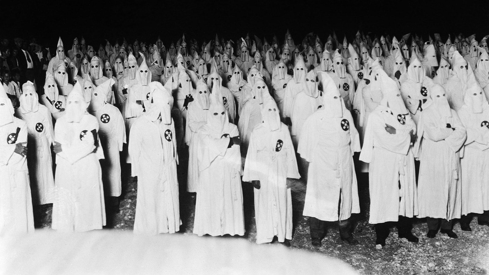 In this image from the early 1920s, a group of Ku Klux Klansmen gather in an unknown location. Like much of America in the early 1920s, Wyoming seemed an opportunity for expansion for the Ku Klux Klan. Newspaper headlines proclaimed new chapters and the Klan openly advertised its growing numbers, but opposition and scandal would eventually bring the group down.