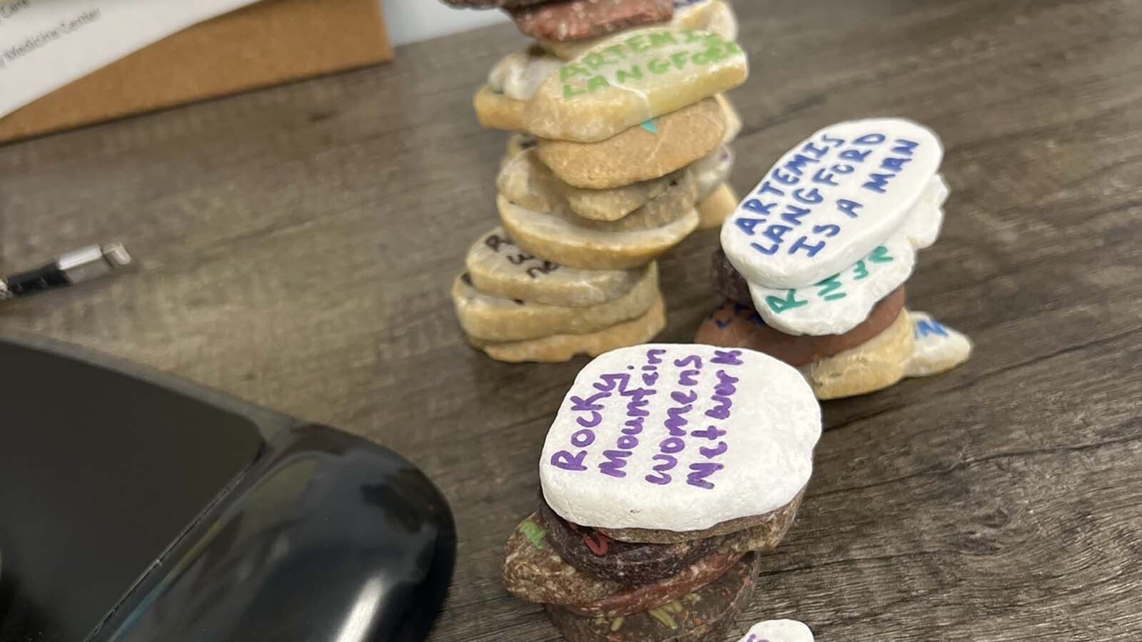 Some of the painted rocks that were spread around the University of Wyoming campus near the Kappa Kappa Gamma sorority house Thursday evening.