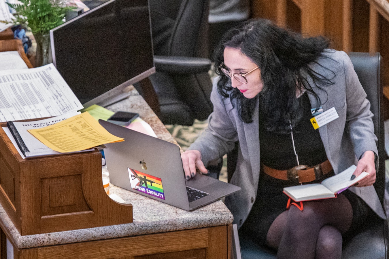 Rep. Karlee Provenza, D-Laramie, works on the Wyoming House floor at the state Capitol in Cheyenne during the 2022 legislative session in this file photo.