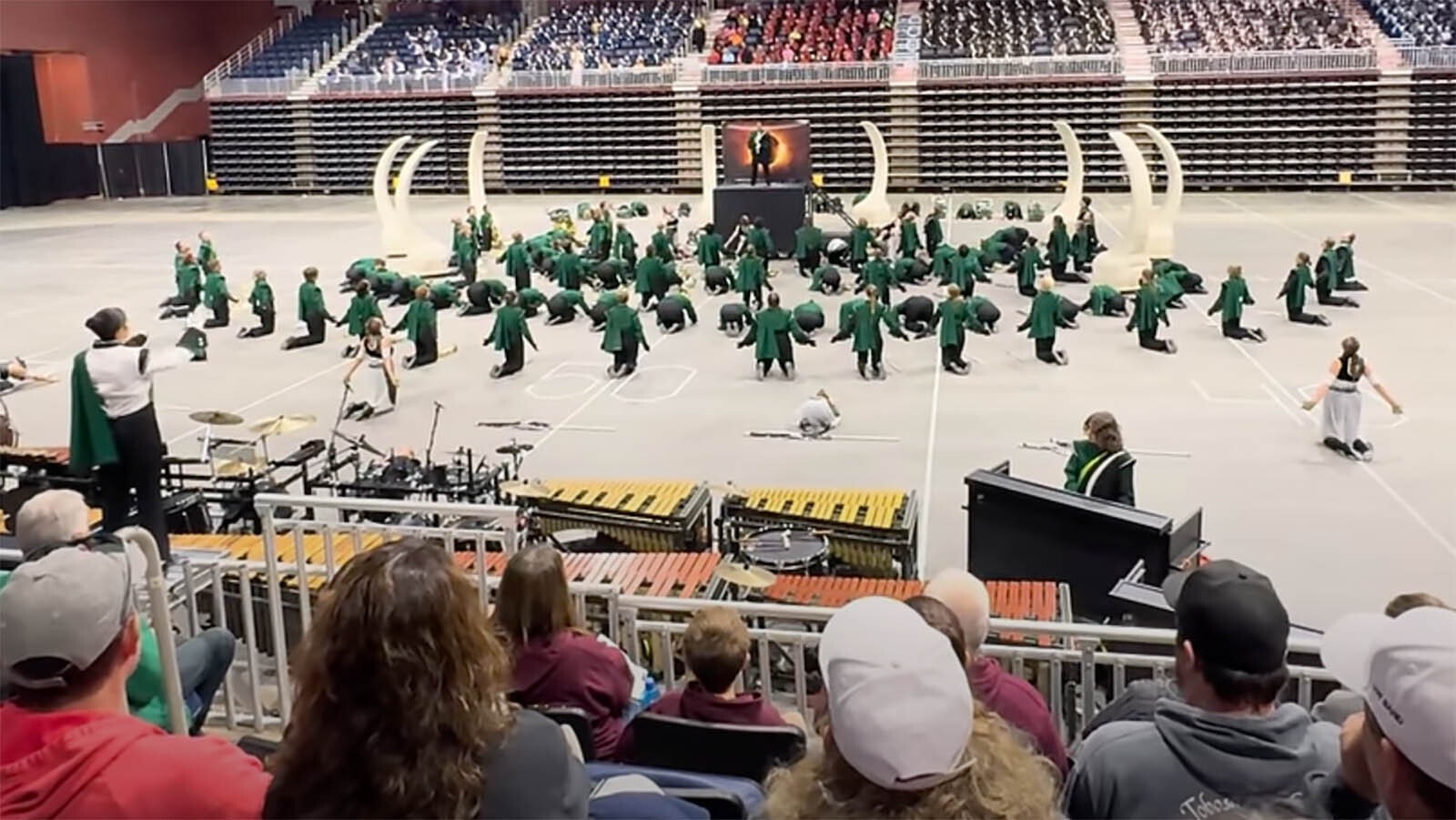 Kelly Walsh High School marching band performs “The Offering” as shown on YouTube. Part of the performance involves kneeling before an eclipsed sun.