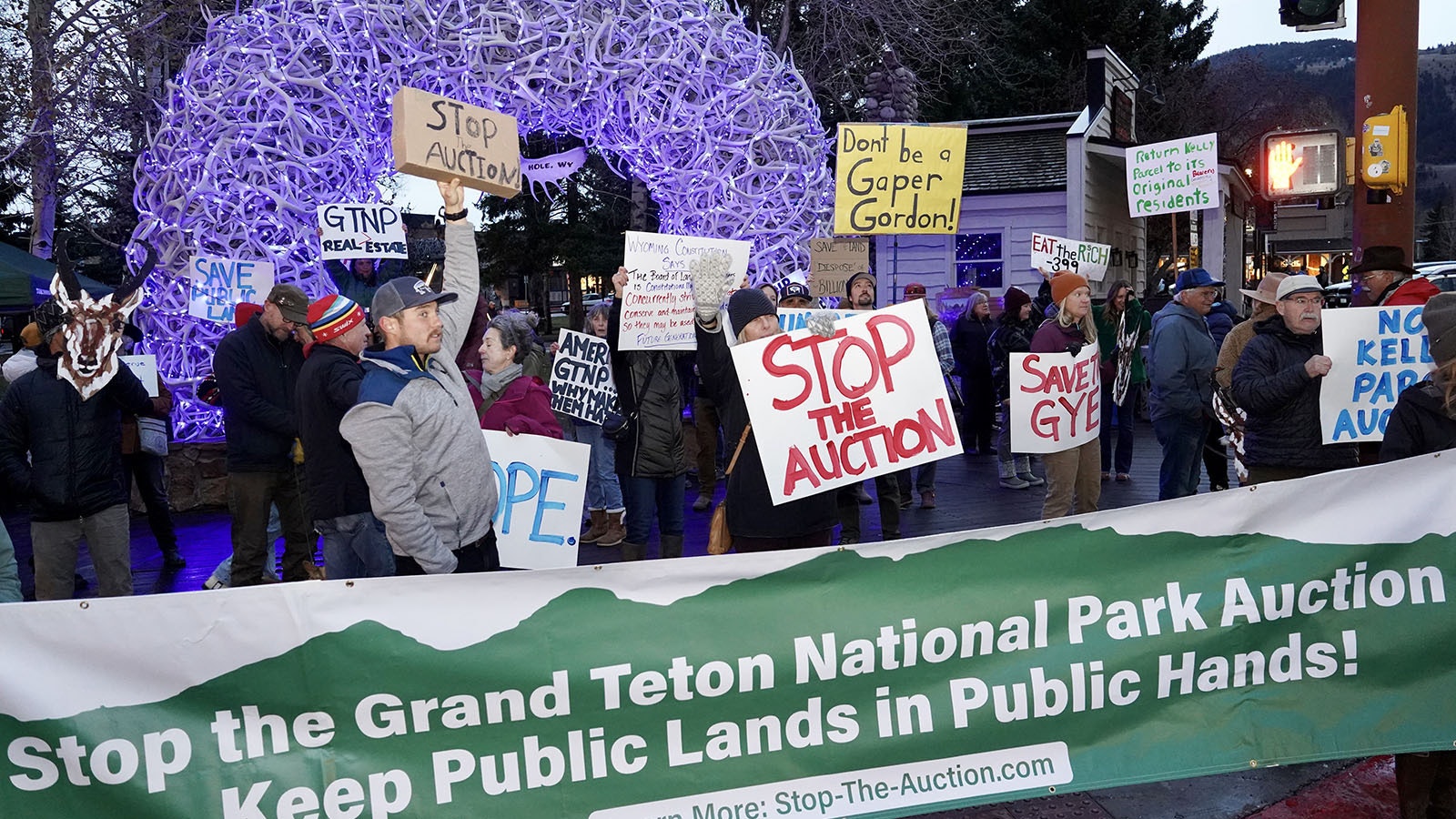 Members and supporters of the Jackson Hole Conservation Alliance rally against the potential public auction of the Kelly parcel in Grand Teton National Park.