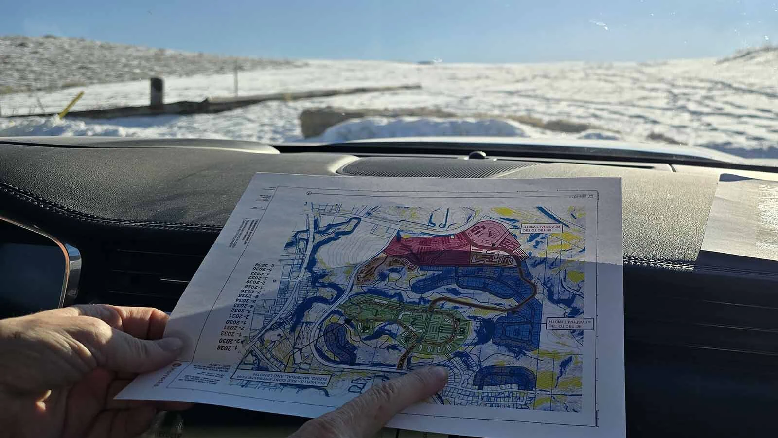 A field of dreams. The map below shows the shape of development to come on the landscape pictured beyond the windshield. Two major developments are planned, the Gateway subdivision and Canyon Road.