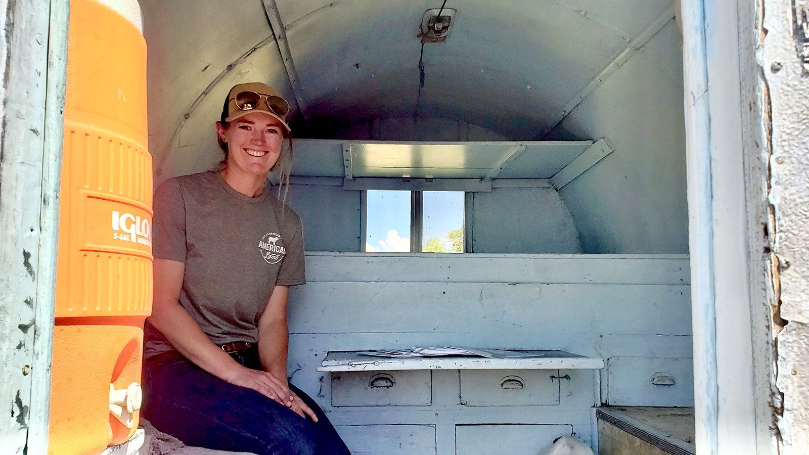 Marie McClaren sits in one of the sheepherder cabins for a photo.