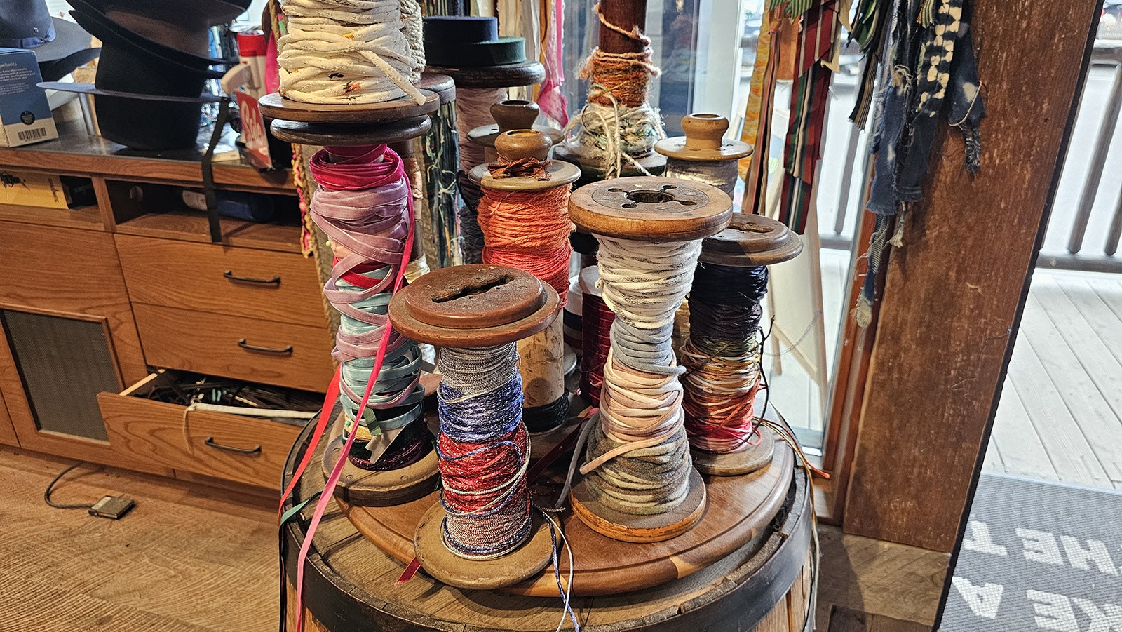 A variety of twine and silk are available for $10 a pop to add color to hat bands.