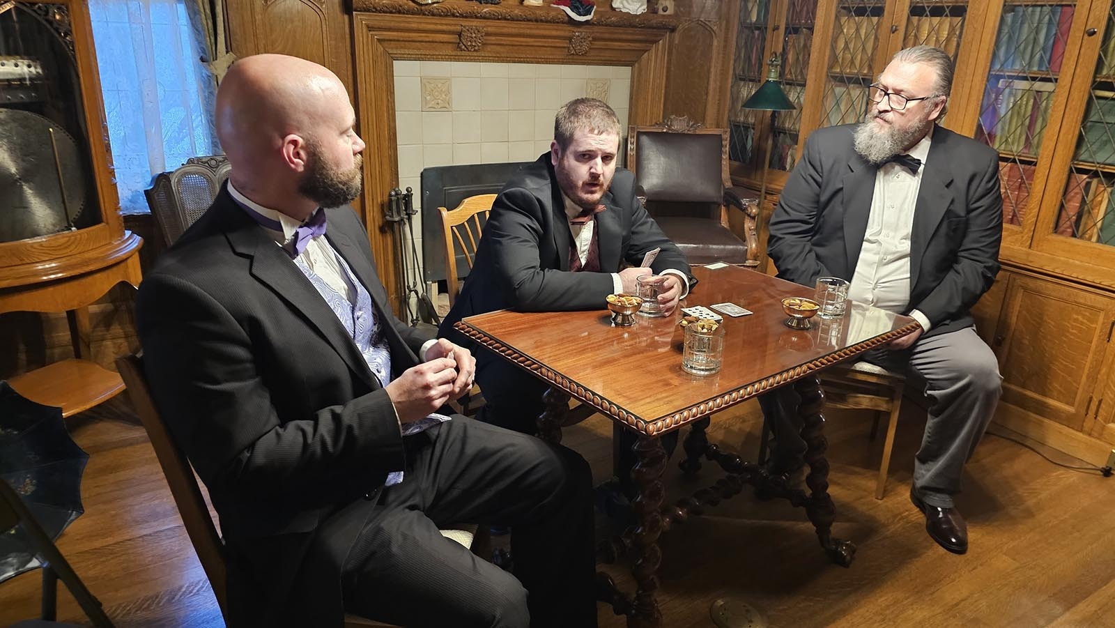 John Kendrick, far right, played by Jonathan Broersma, talks with Tom Kendrick (Jim Barth), left, and Clarence Wulfgen (Spencer Pavatt), center about politics as they prepare to play a round of cards.