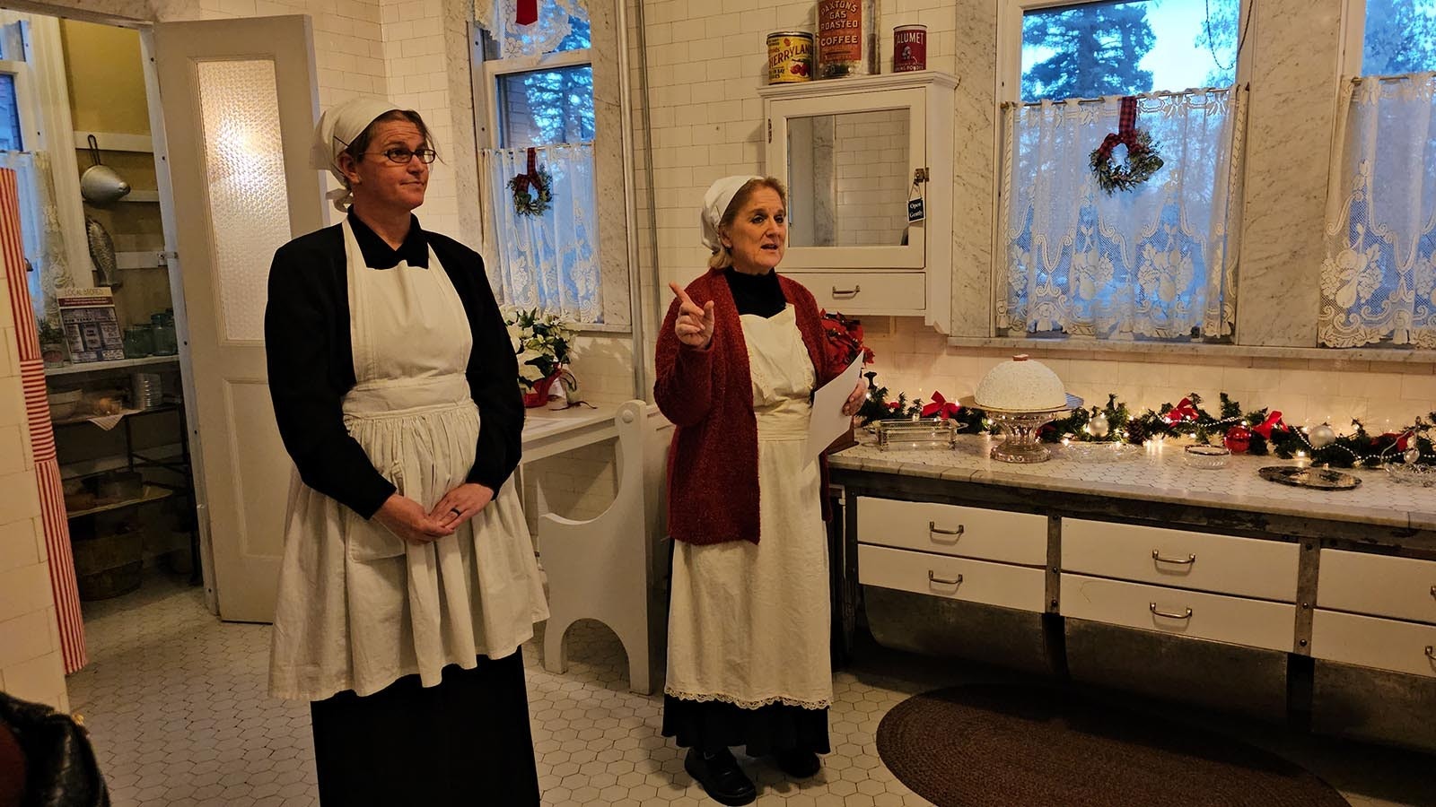 The two Mrs. Johnsons in no particular order — Lottie Johnson (Baleen Juergens) and Mrs. Johnsie Johnson (Erica Bainter) — go over the menu for a 1924 holiday dinner party at the Kendrick's mansion in Sheridan.