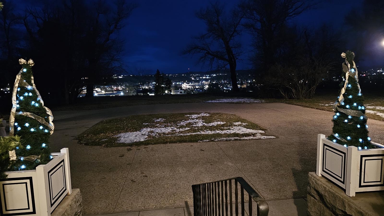 The nighttime view from the Kendrick Mansion looks out over a well-lit Sheridan.