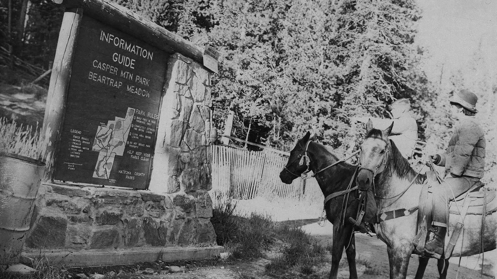 Riders pause at a sign in Beartrap Meadow during the hunt for Kevin Dye in 1971.