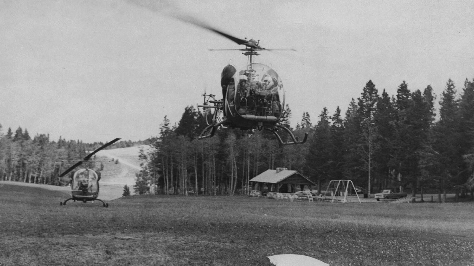 Helicopters land in a meadow on Casper Mountain as part of the search for Kevin Dye in 1971.