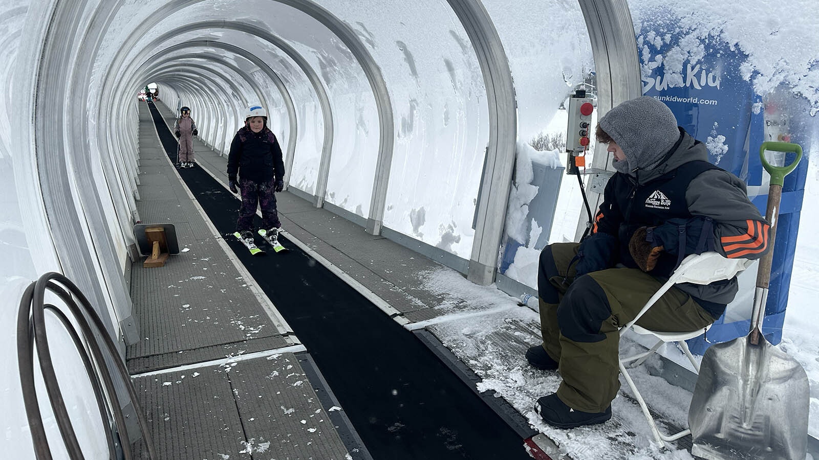 The first president of President Madison Murther, 7 -year -old, rides the magic carpet to slide down the Happy Trails Ski slope at the Antelope Butte ski resort. Operator Jonah Obo observes his progress and is there to help anyone who needs help.