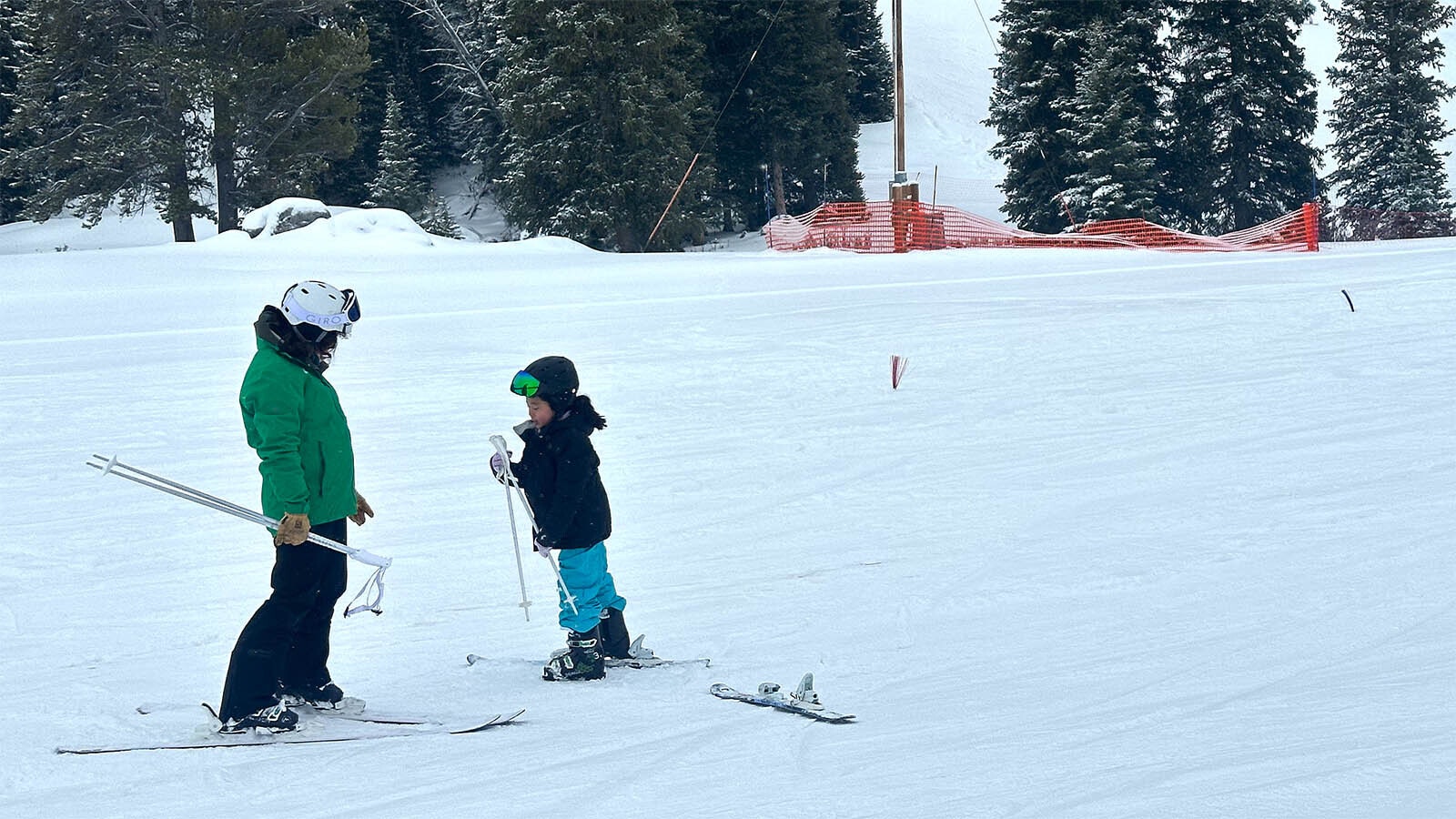 The first student of the chairman Jeji learns the basics of skiing from his instructor SJ Grote at the Antelope Butte ski resort.