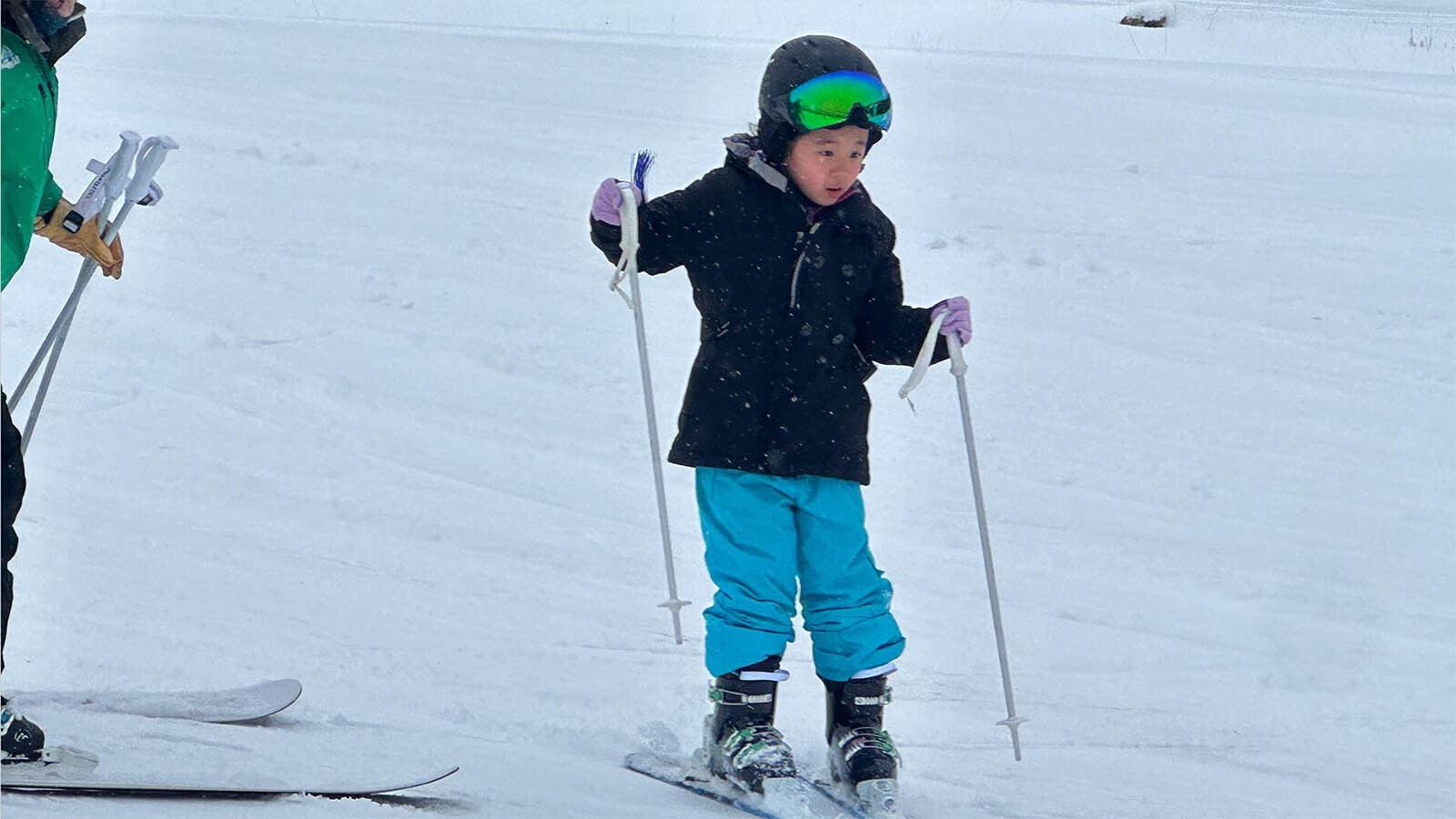 This is the first student of the chairman Jeji for the first time in skiing and she is nervous as she slides on the ski slope Happy Trails in the Antelope Butte ski resort.