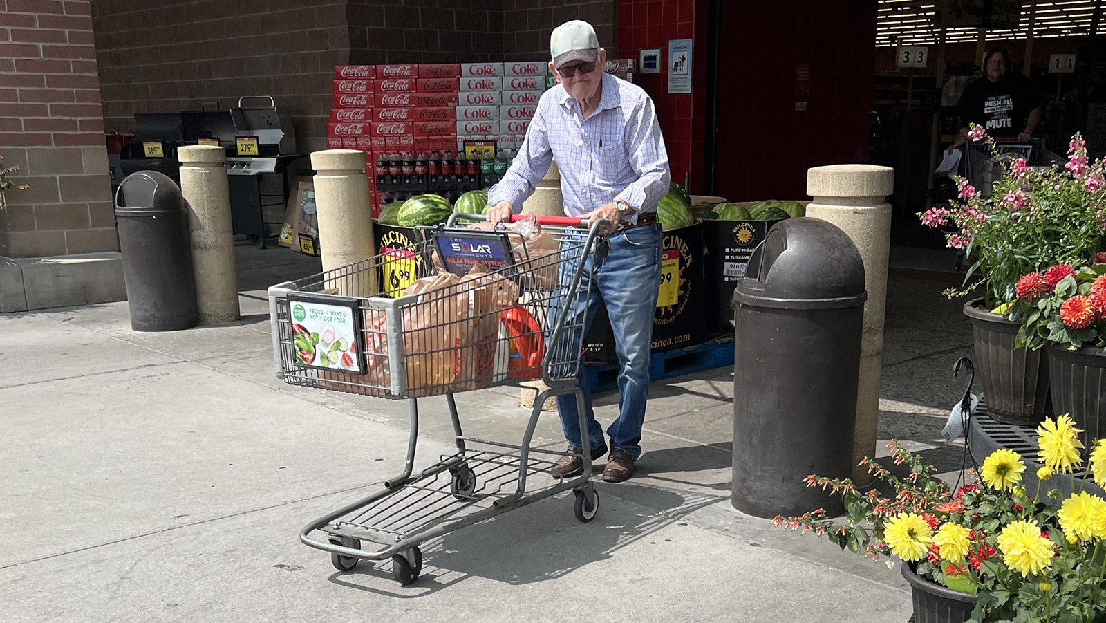 A shopper leaves King Soopers in Cheyenne with groceries in this file photo.