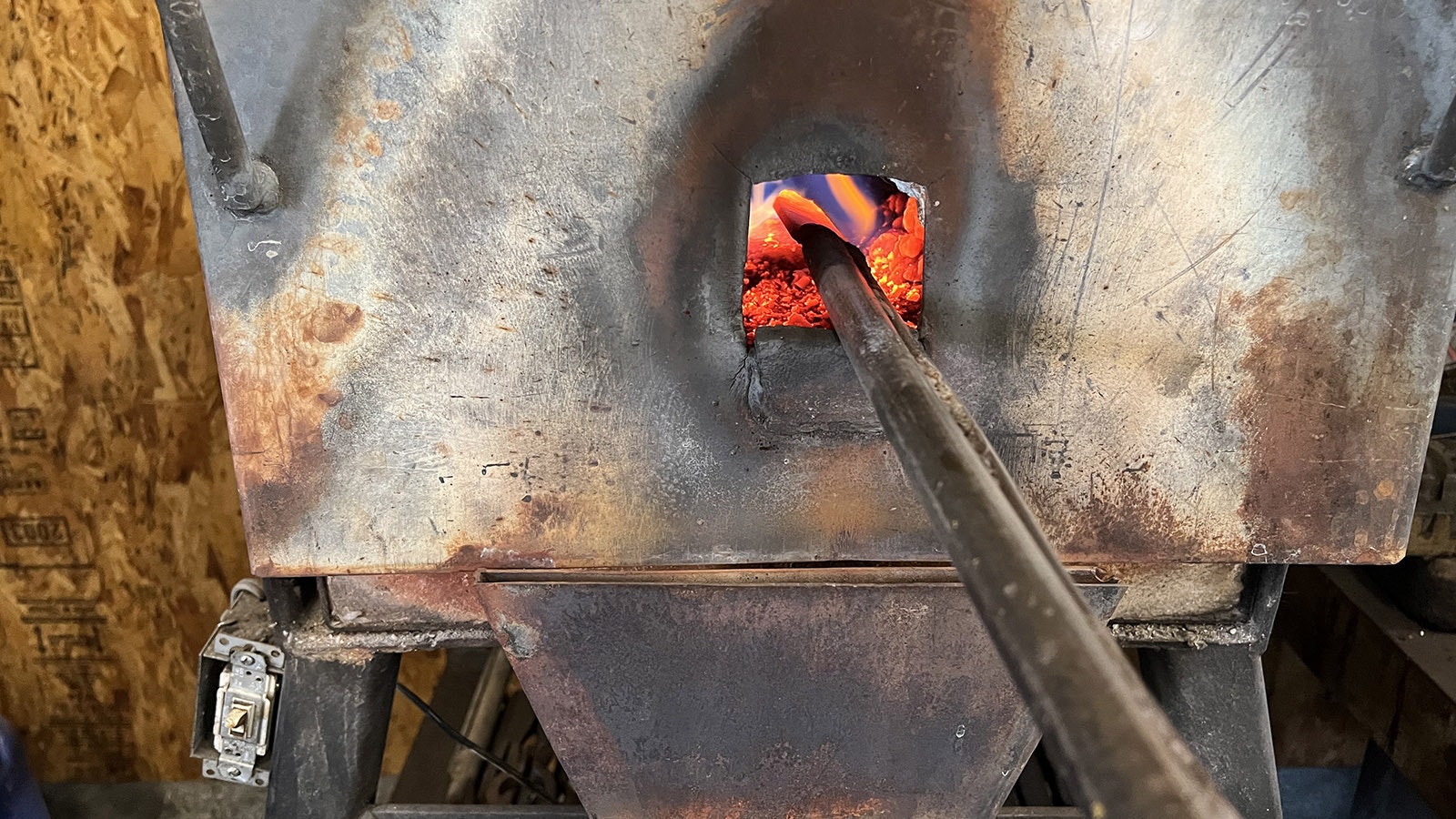 A knife blank on the end of a steel rod heats up to red-hot in Ed Fowler’s knife workshop near Riverton.
