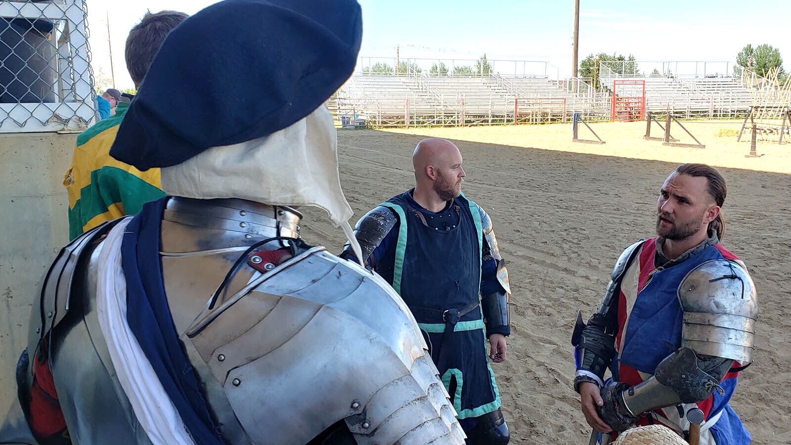 Colorado Wardens Captain Greg Fisher right talks about the fight lineup ahead of hand-to-hand combat on foot in the ring during the Tournament of Knights.