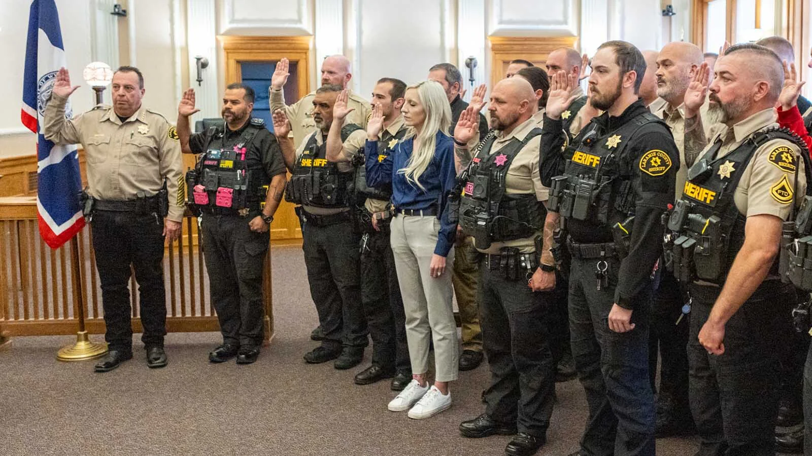 Sheriff Kozak, far left, and 25 Laramie County deputies were sworn in by ICE and authorized to enforce immigration law under Title 8, Section 287(g) of the Immigration and Nationality Act during the an October 2025 press conference announcing a new 25-officer ICE force for Laramie County.
