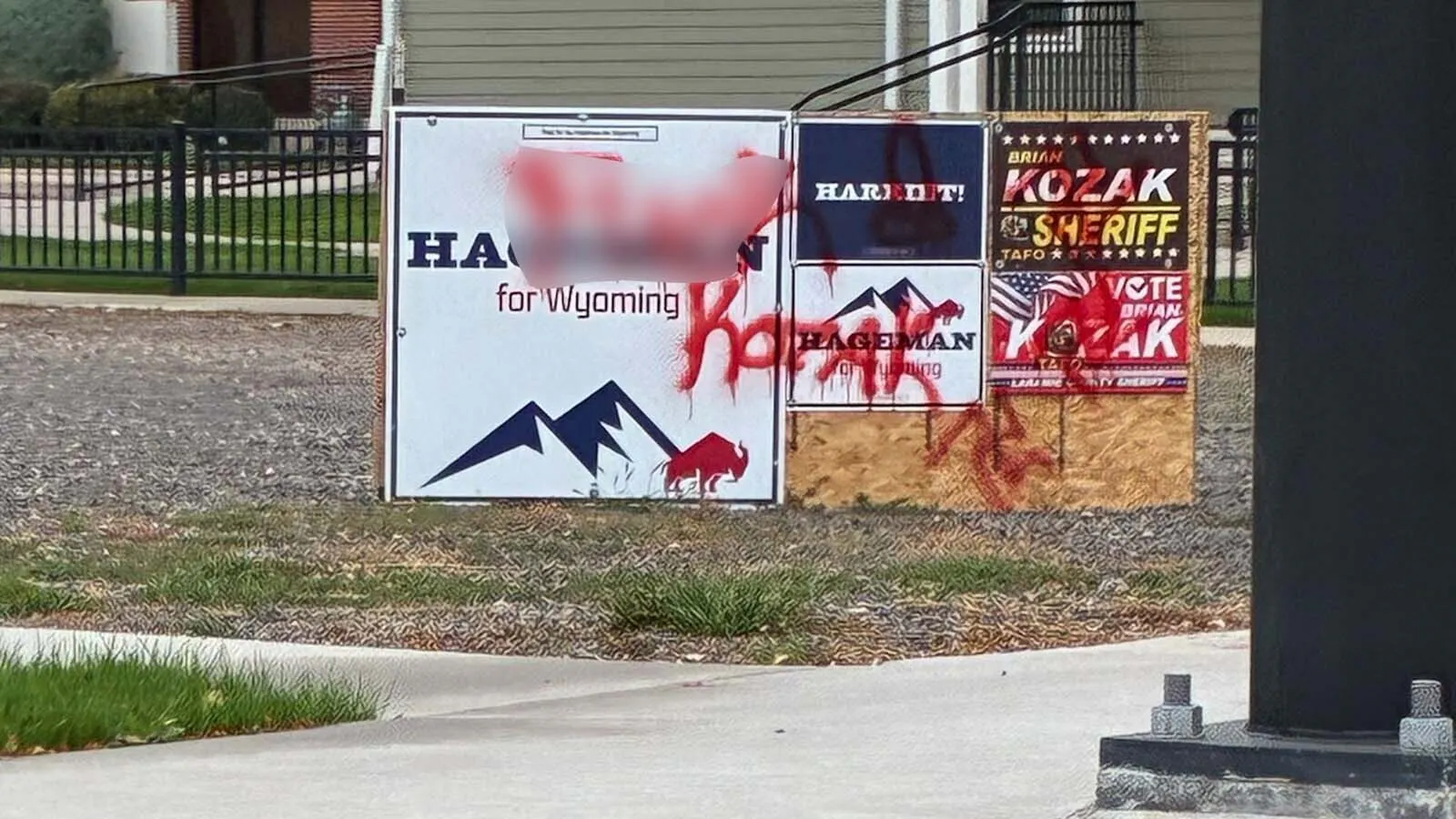 A row of political signs in downtown Cheyenne got an unwanted makeover with red spray paint, including three swastikas, a phallic symbol and an obscenity targeting Sheriff Brian Kozak.