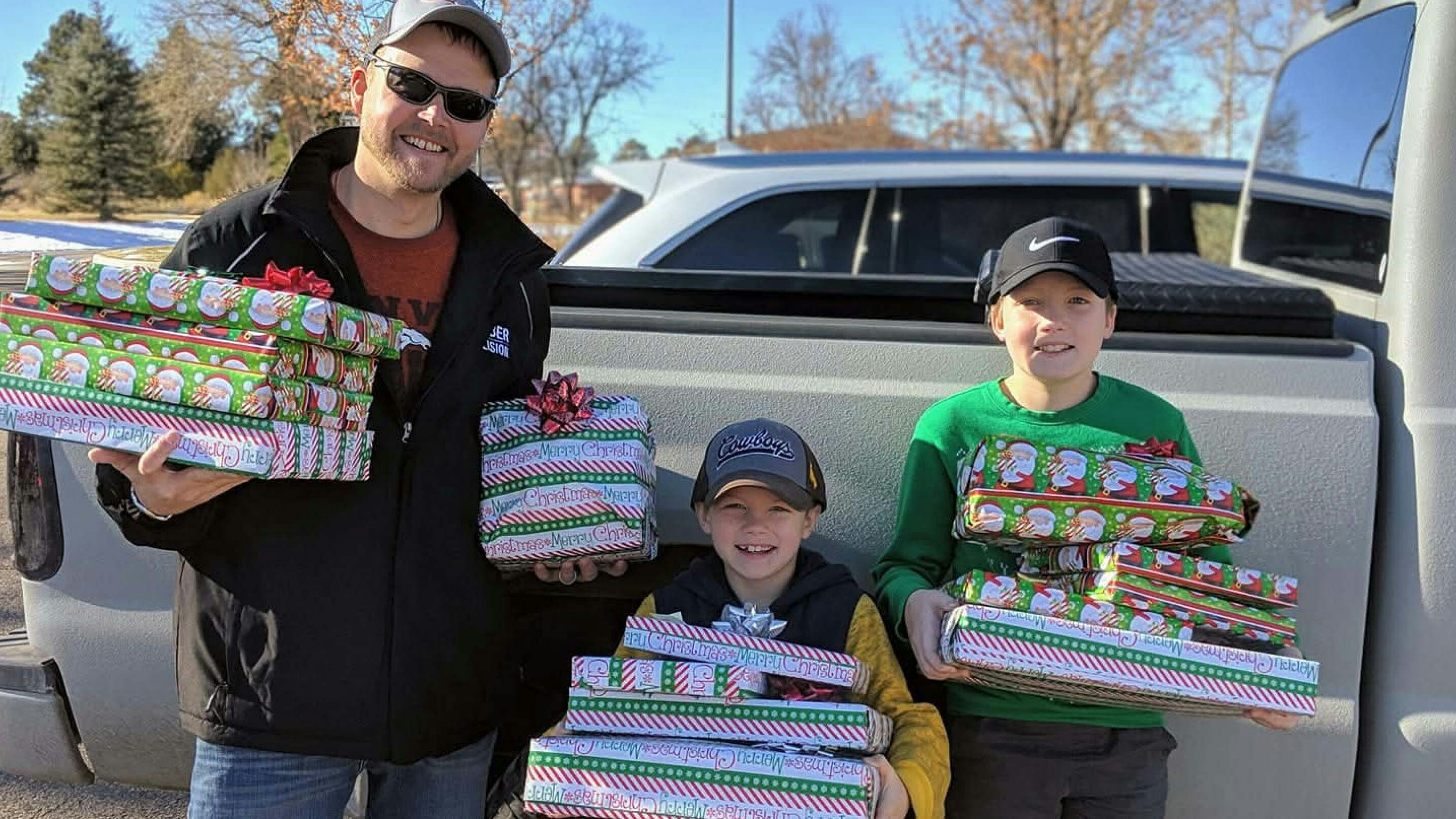 Adam Van Der Hoeven, with his children Cyler and Carter, as they prepare to commit a random act of kindness.