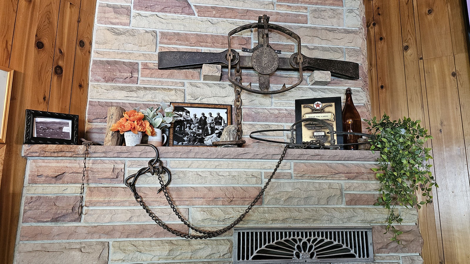 These traps belonged to Joe Kudar and are displayed above the fireplace at the Kudar Cabins.