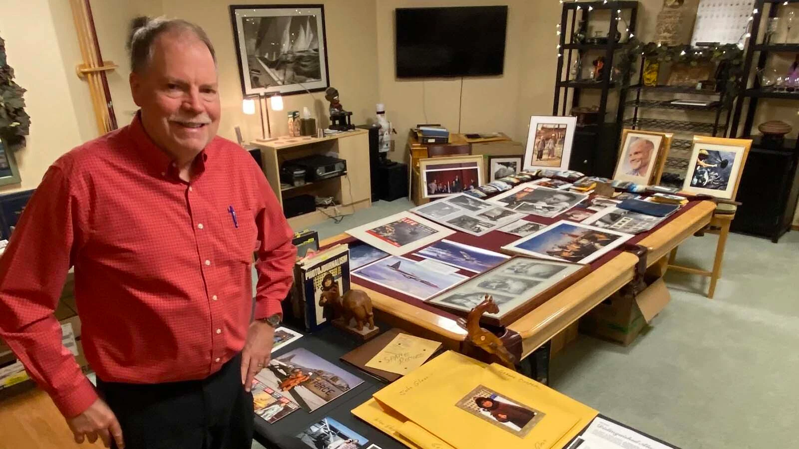Kurt Conger with some of his father's photos. Kurt Conger with some of his fathers photos.