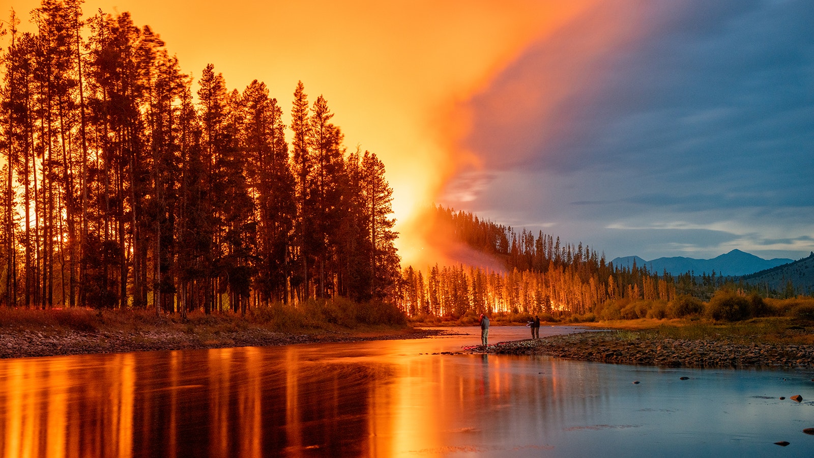 In this 20-second single exposure, the Alder Creek Fire burns along the Bighole River in Montana with the Pintler Mountains in the background. This was taken from what is called a spike camp, which is a small campsite where a wildland firefighting crew spends the night. It is Miller's favorite photograph he's taken to this point.