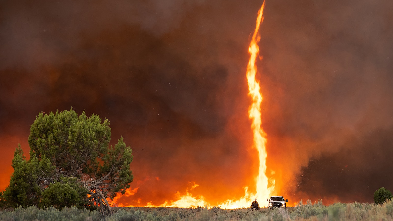 A fire whirl forms when intense heat from a fire creates a rotating column of air. This rotating column can draw in burning embers and debris, potentially causing the fire to spread rapidly and unpredictably. Fire whirls pose a significant risk to firefighters and nearby communities, as they can create their own weather conditions and spread flames beyond the main fire perimeter.