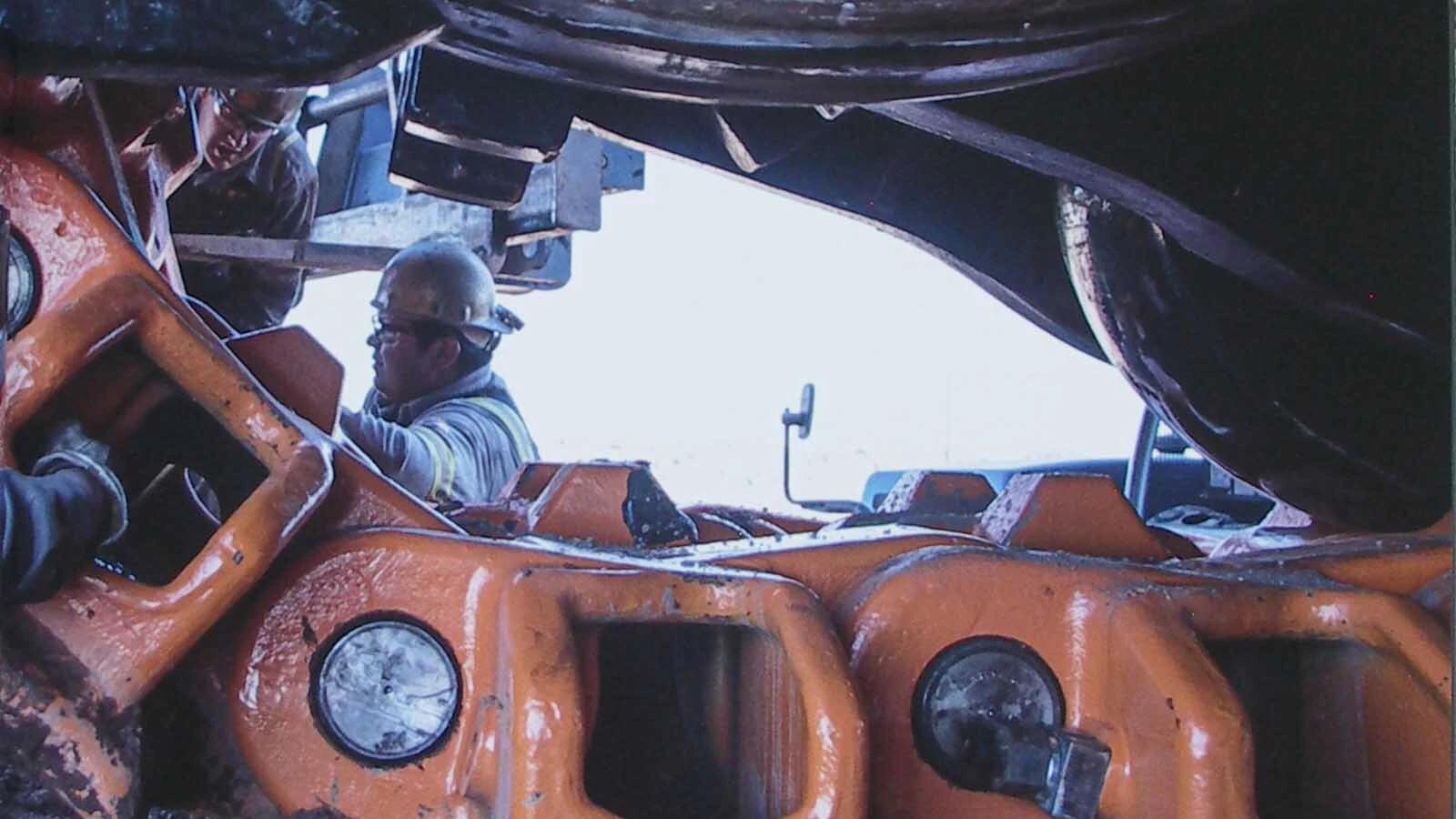 L&H Industrial workers install an undercarriage system on a giant piece of mining machinery at the Buckskin Mine near Gillette, Wyoming.