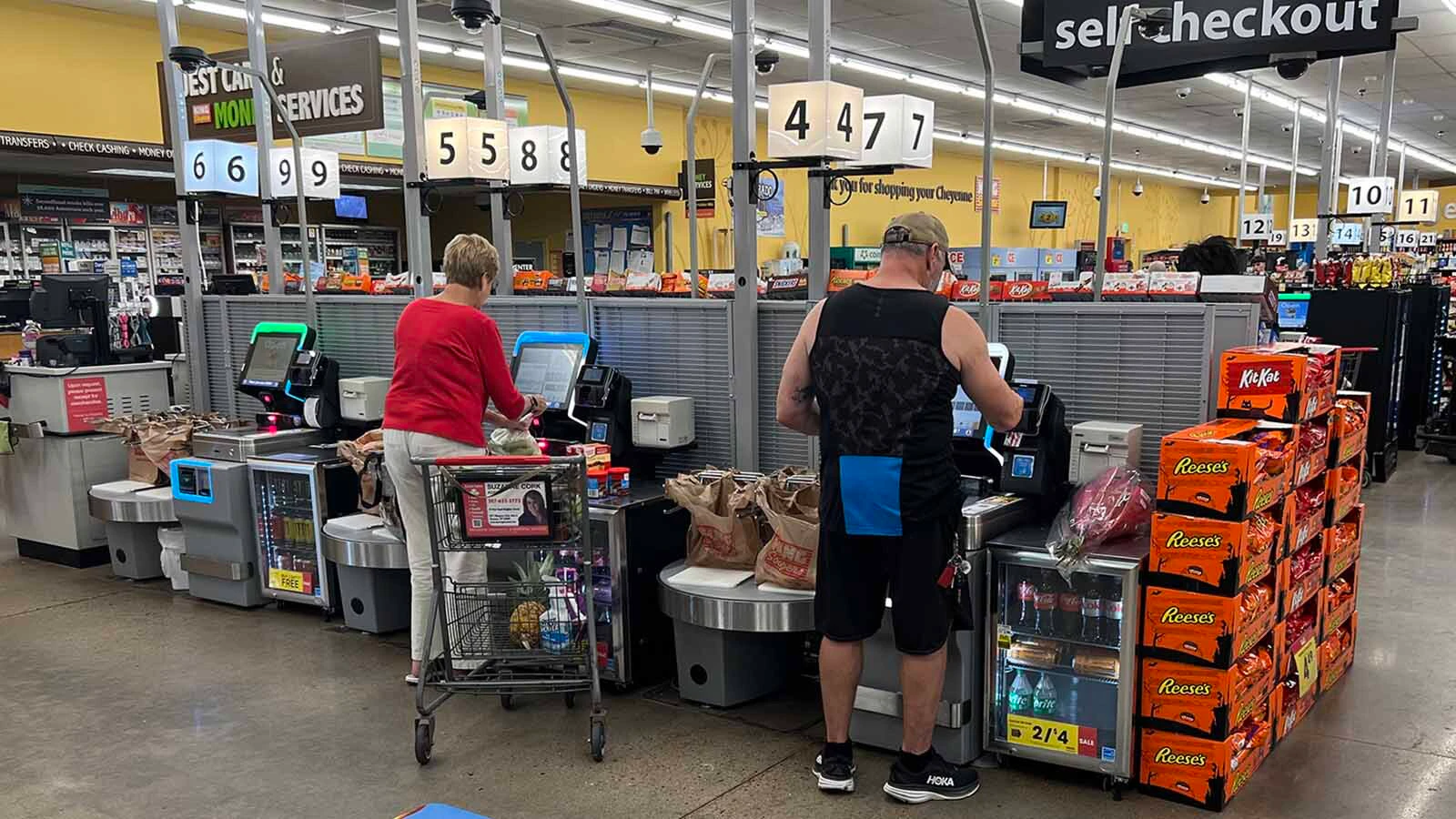 Some businesses, like grocery stores in this file photo, offer self-serve options that require fewer employees to operate.