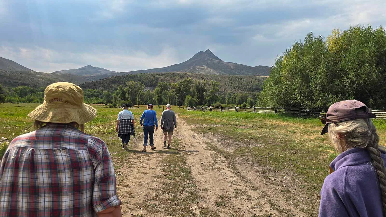 Tour participants head in to the Ladder Ranch during a summer tour exploring the battle site of Jim Baker.