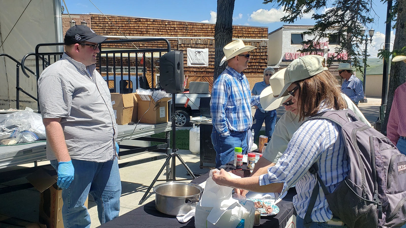 Participants line up to try lamb prepared several different ways during a recent cooking demonstration in Kemmerer.
