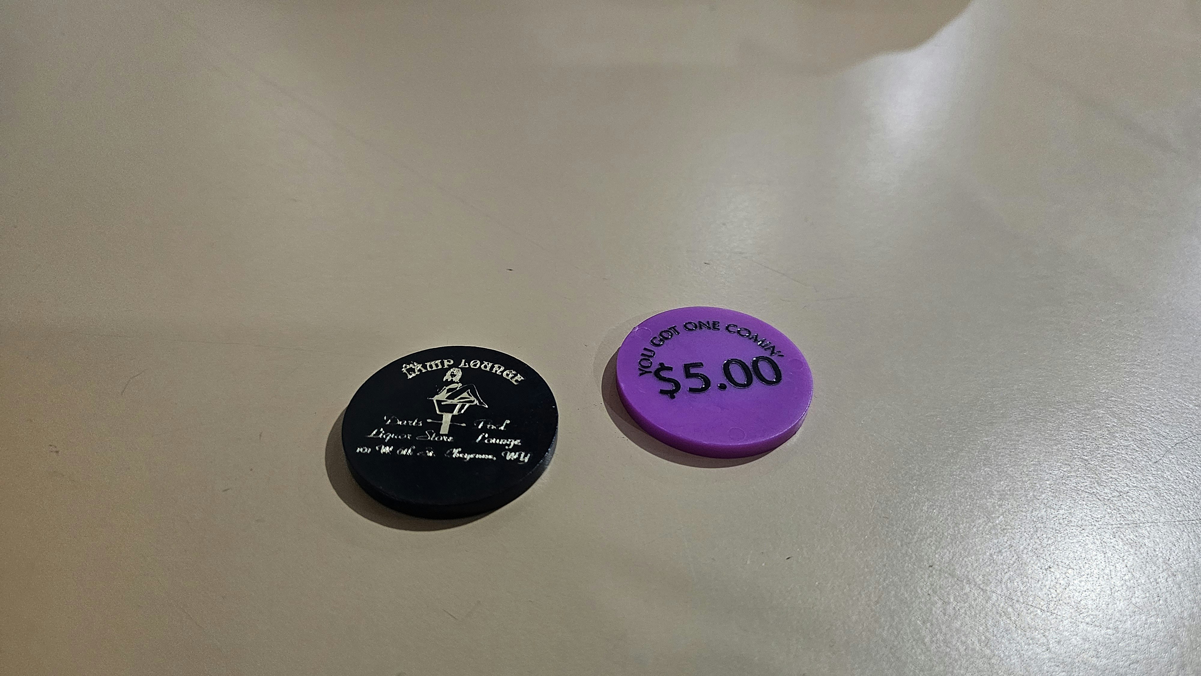 Two of the historic poker chips Michael Jordan found in the Lamp Lounge, a dive bar on the south side of Cheyenne.