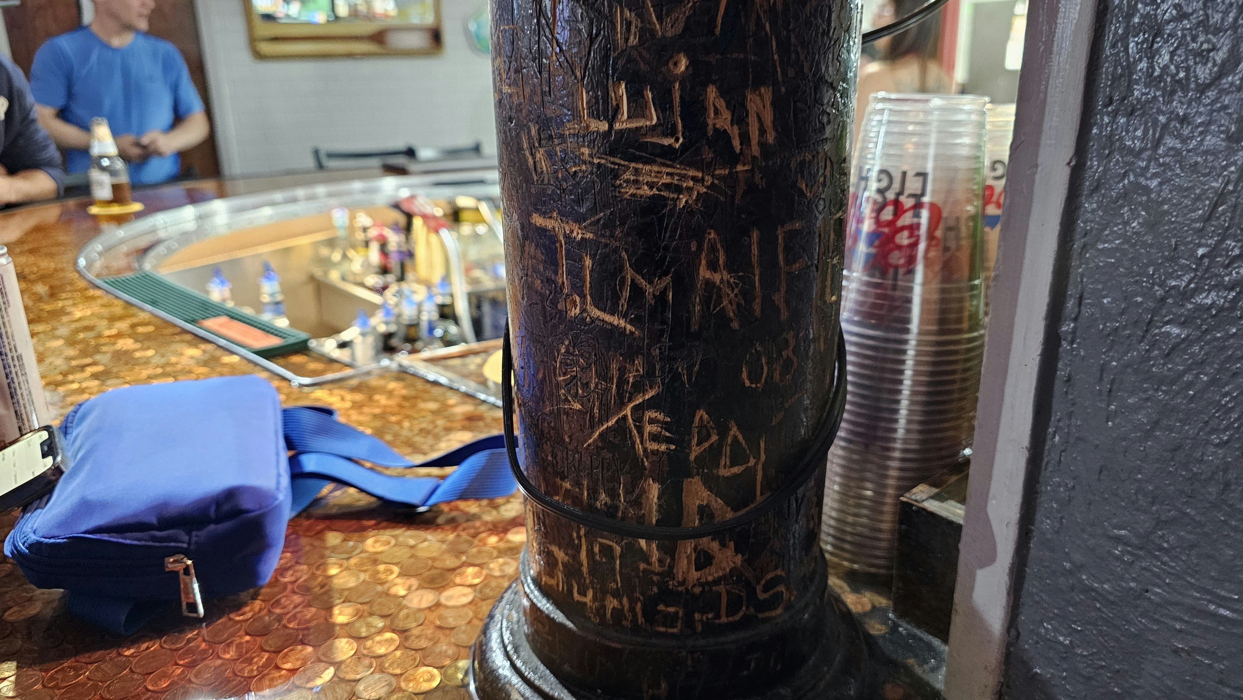 The wood post where people have carved their names is still in the Lamp Lounge on the south side of Cheyenne.