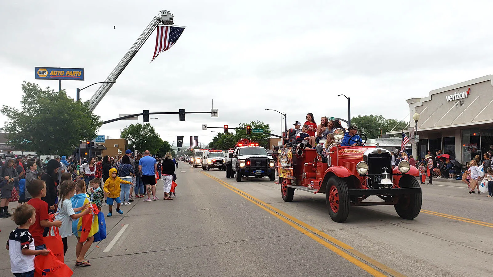 Sirens blare at the start of Lander's Fourth of July Parade.