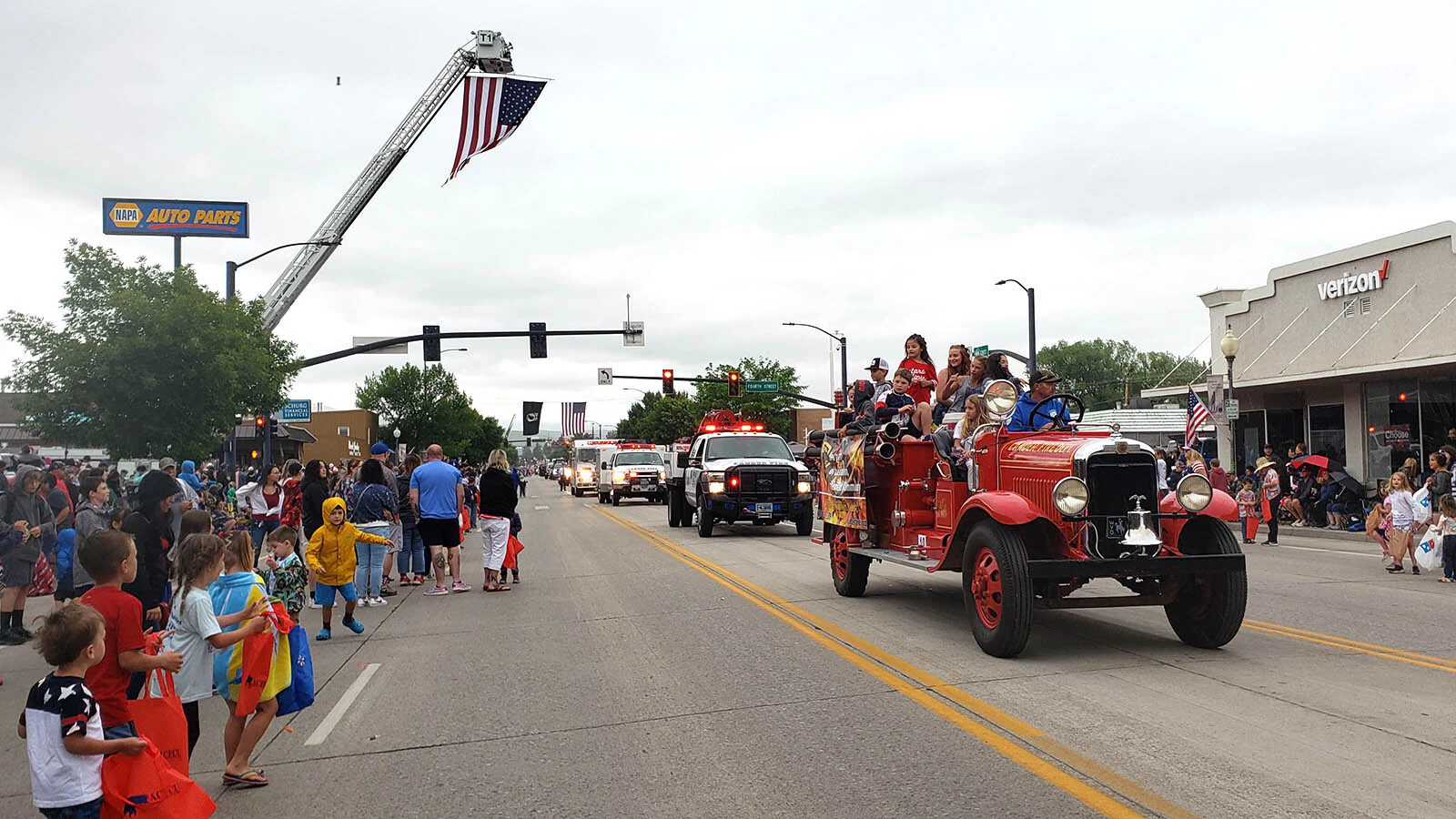 Sirens blare at the start of Lander's Fourth of July Parade.