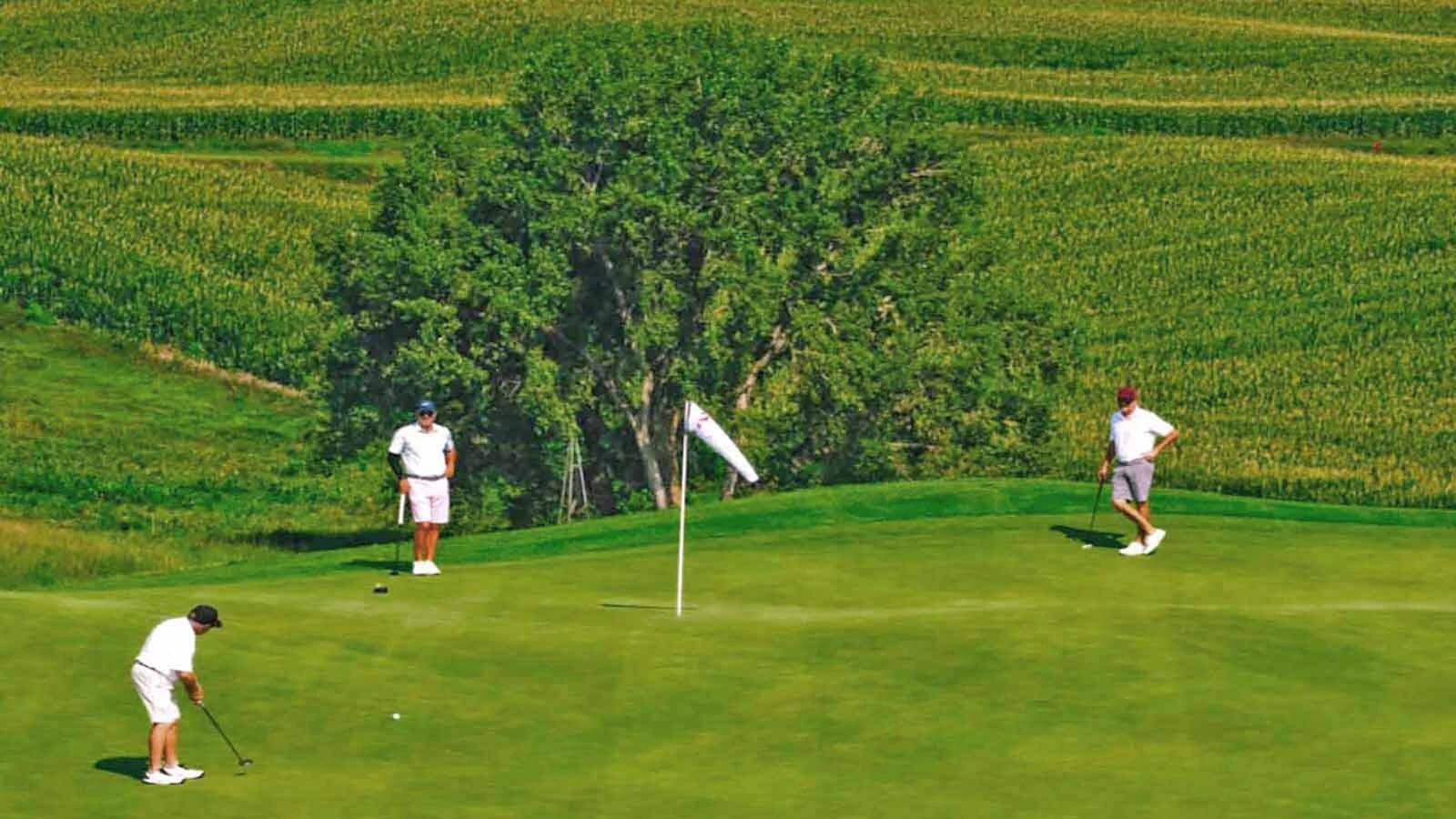 The pins at Landmand Golf Club are marked with windsocks instead of flags to help golfers see them and know how hard the ever-present wind was blowing.