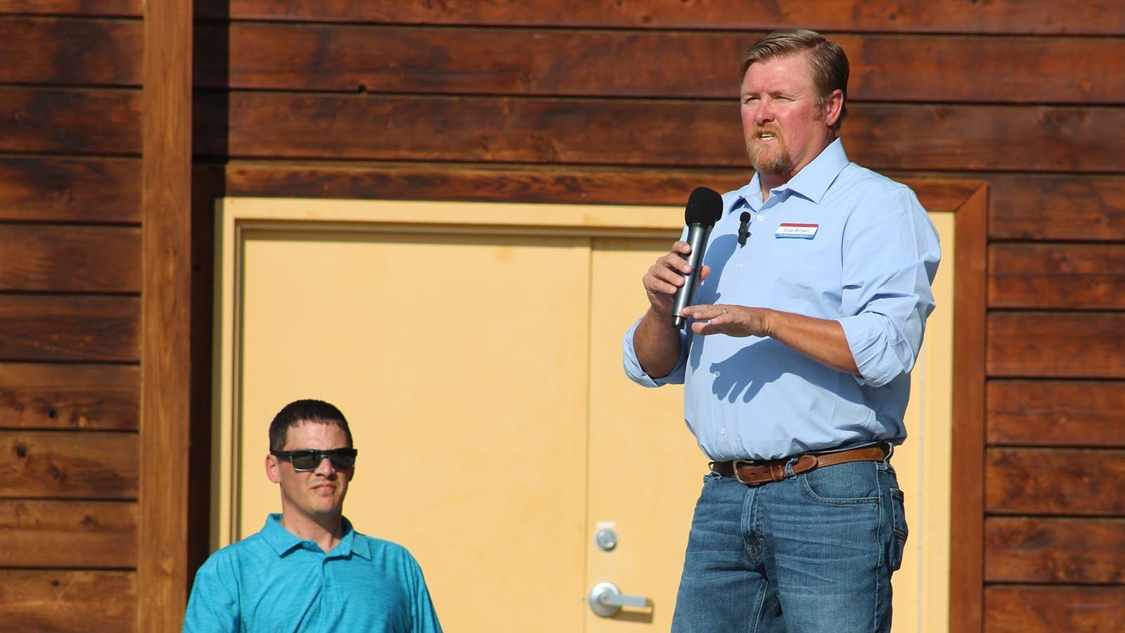 House District 9 candidate Exie Brown speaks during the Laramie County Republican Party's Politics in the Park event Wednesday night. He accused his opponent, state Rep. Landon Brown, left, of "flip-flopping" on votes.