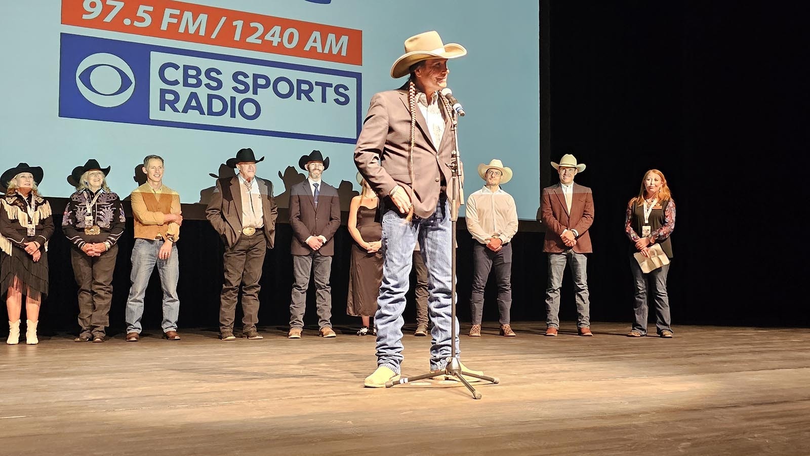 Moses Brings Plenty, who plays Mo Brings Plenty on the hit television series "Yellowstone," talks to a crowd of about 400 about Lane Frost's effect on his life growing up on the Pine Ridge Reservation.