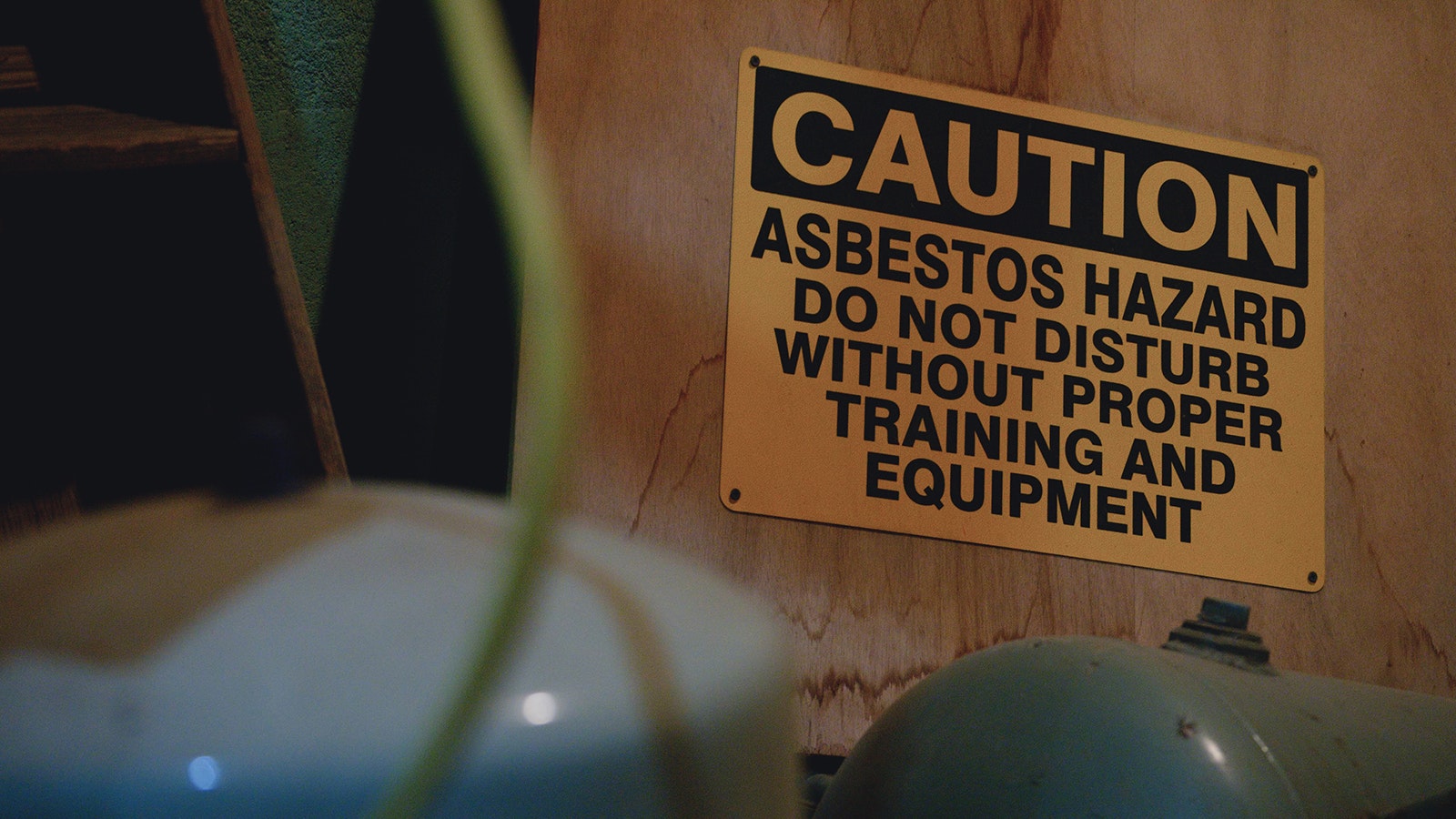 An asbestos hazard sign is pictured in the basement of Laramie Plains Civic Center. Asbestos was used throughout the original building and has slowly been removed since it was converted into a civic center.