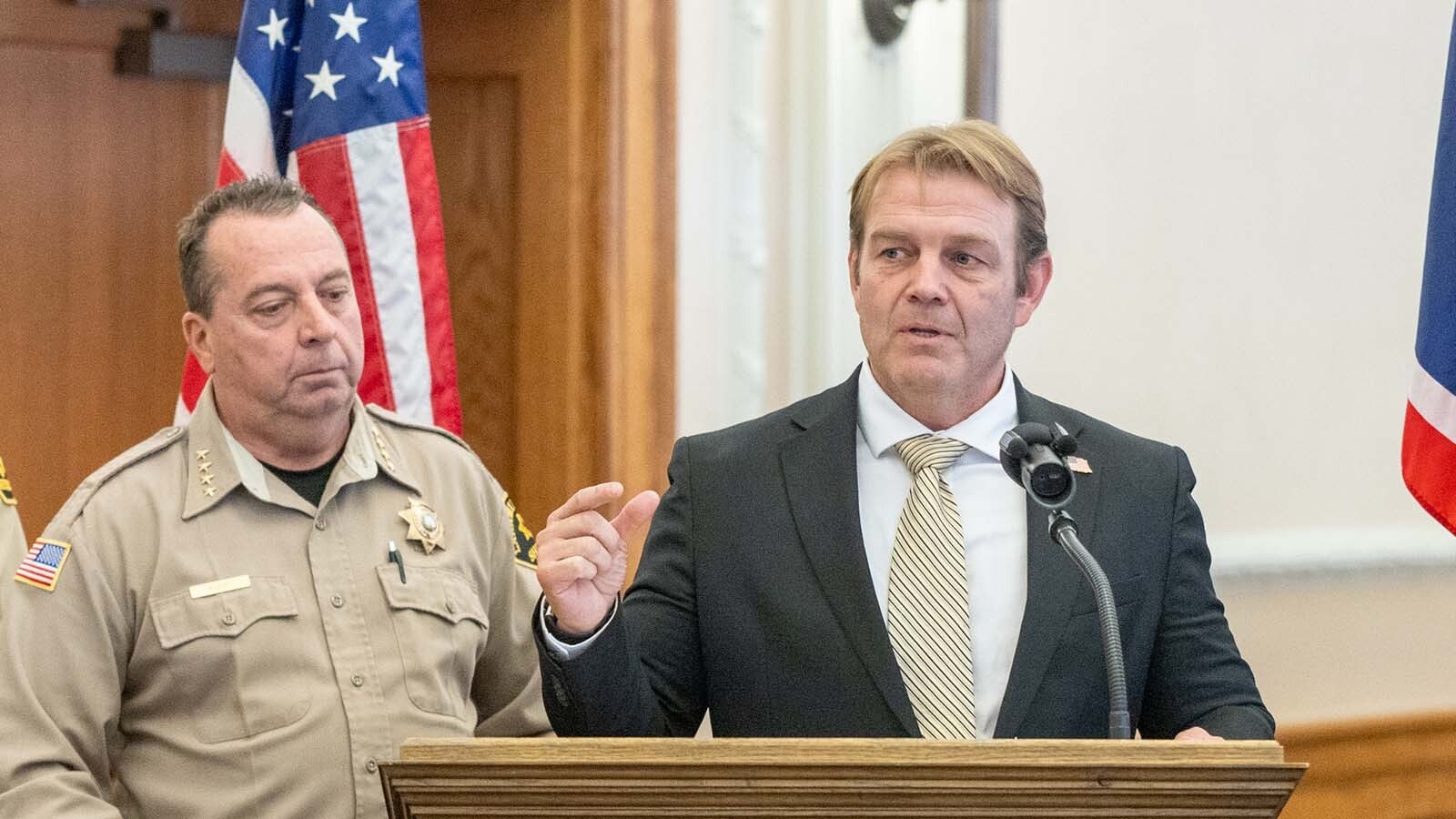 U.S. Attorney for Wyoming Darin Smith speaks at the Laramie County Sheriff's Officer press conference announcing a new 25-officer ICE force for Laramie County on Oct. 1, 2025, in Cheyenne, Wyoming. Sheriff Brian Kozak and 25 Laramie County deputies were sworn in by ICE and authorized to enforce immigration law under Title 8, Section 287(g) of the Immigration and Nationality Act.