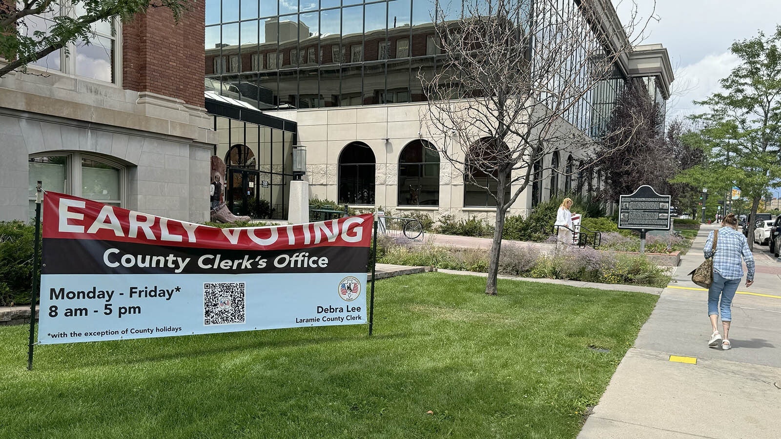 Signs point the way to the Laramie County Clerk's Office in Cheyenne for people who want to vote early.