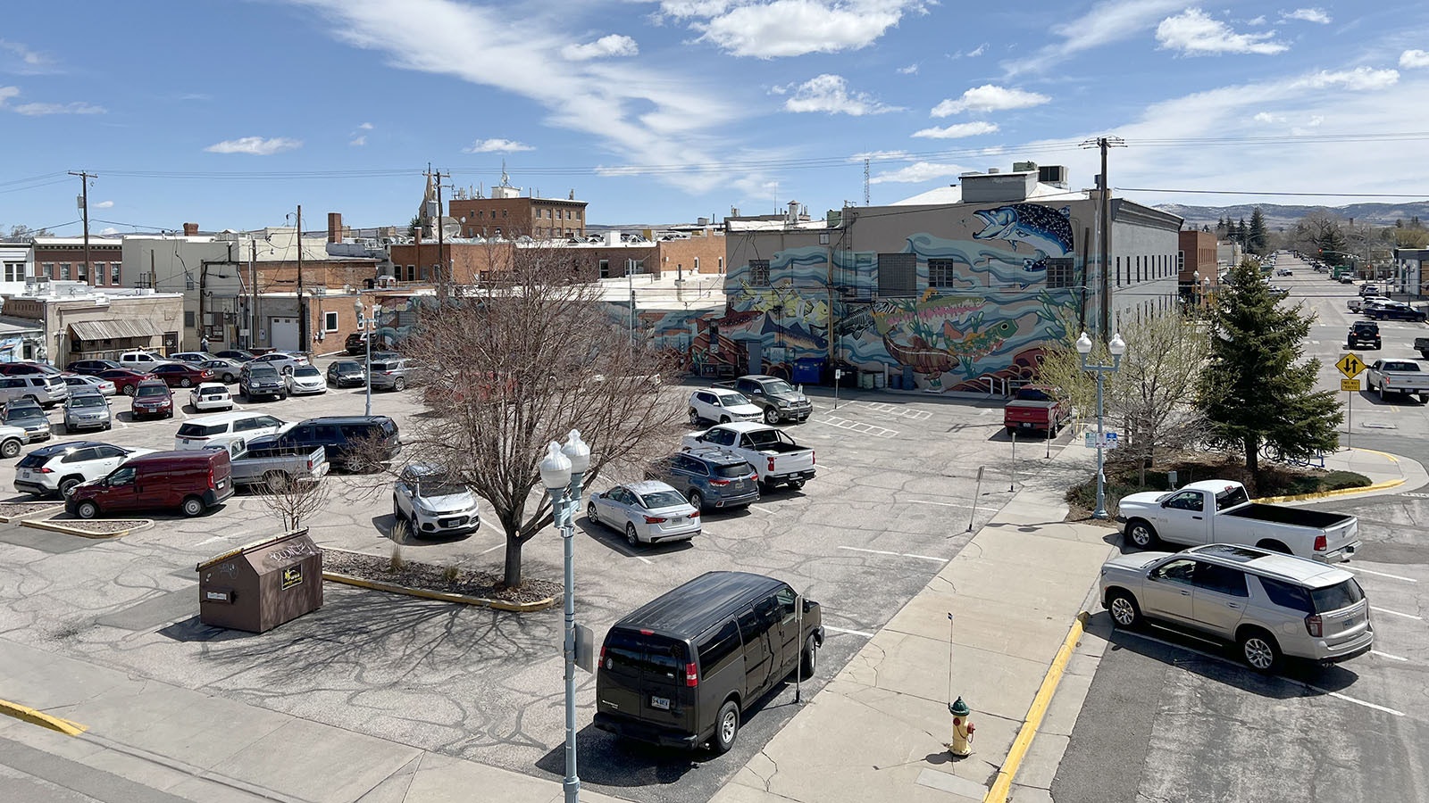 Some Laramie residents worry that a proposed five-story, 88-unit apartment building in this parking lot in the heart of downtown would take up too much space, block views of murals and hurt the historic aesthetic.