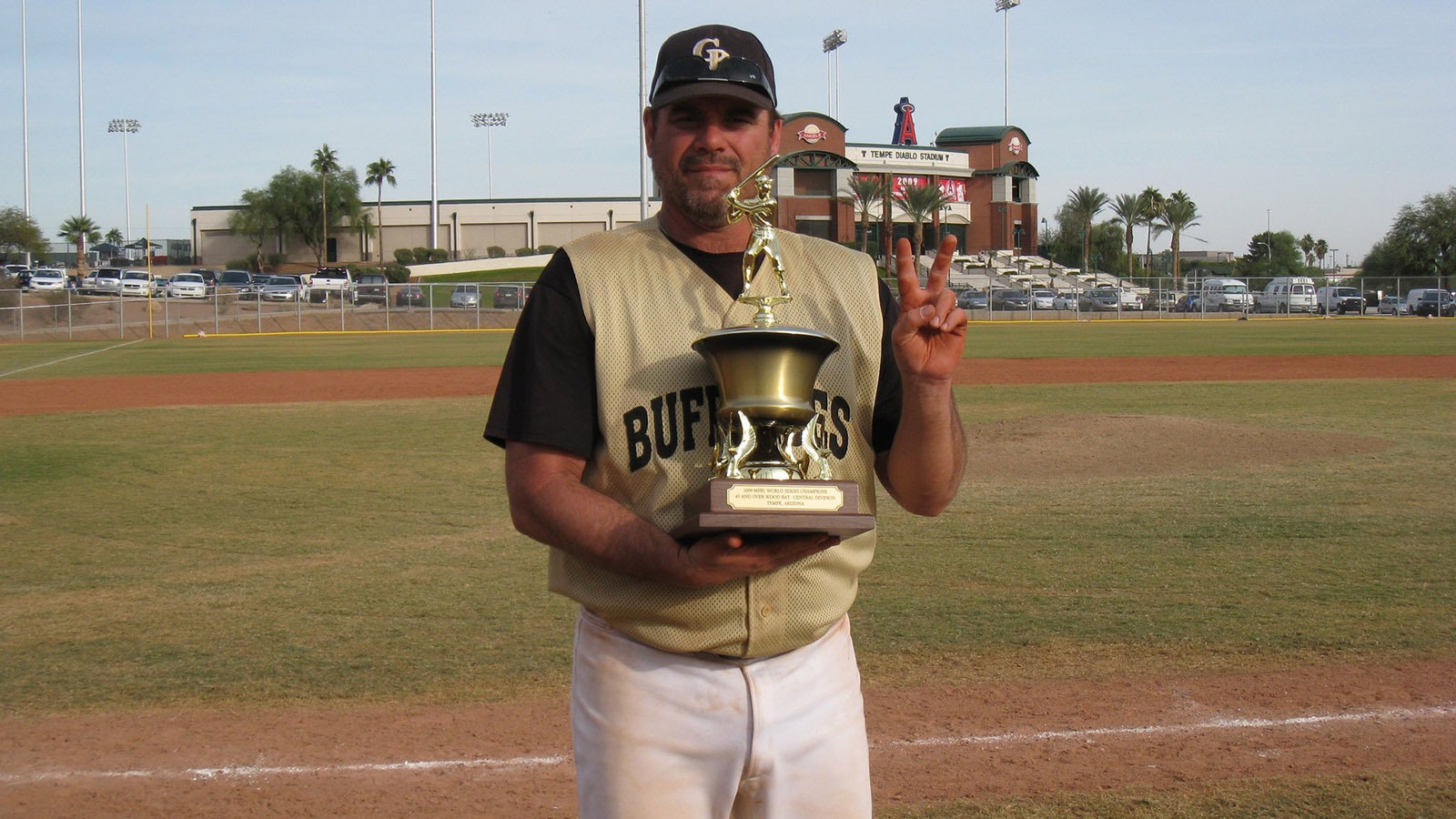 Larry Proietti still finds time to fit in a game of baseball.