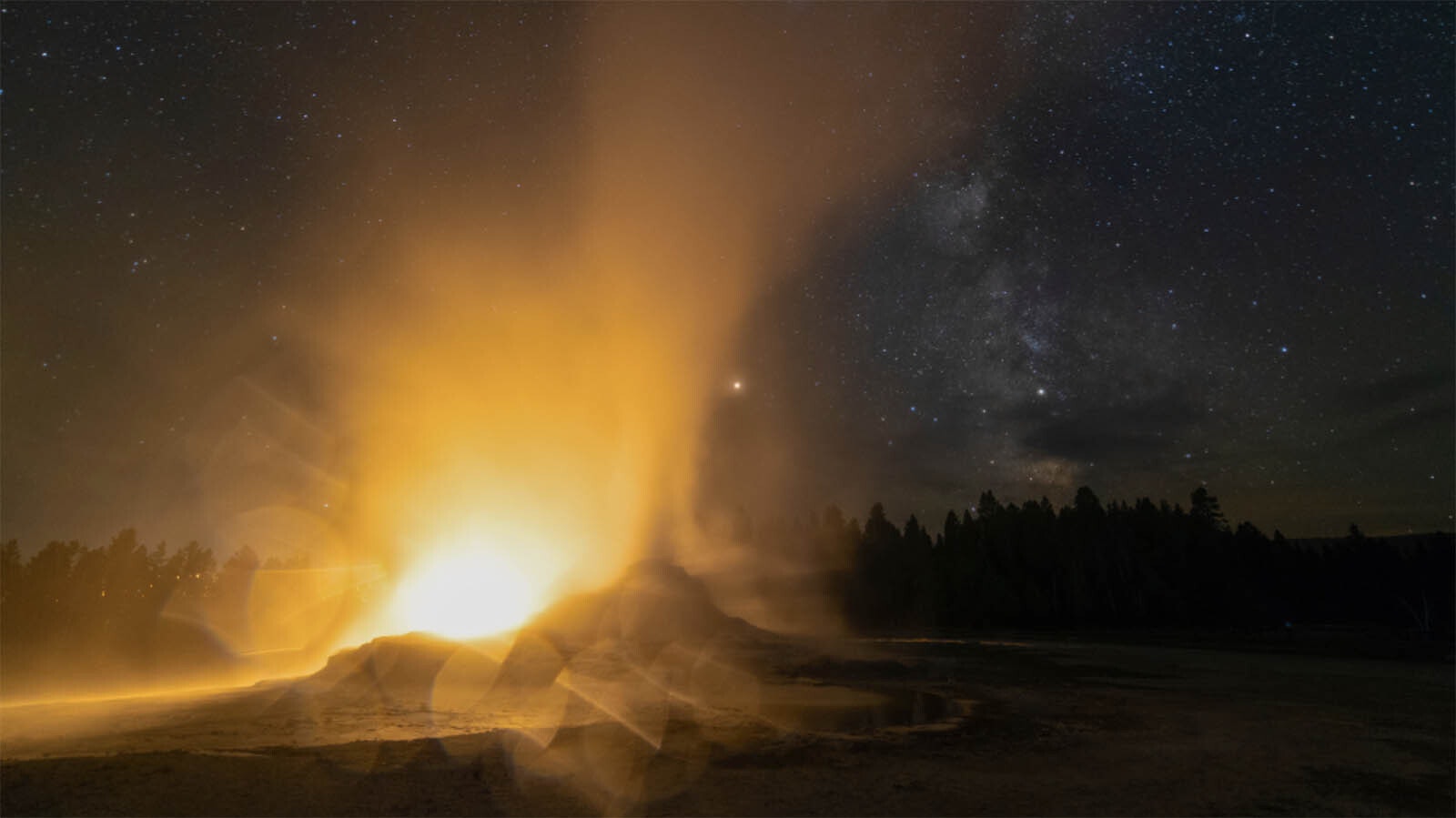 One of the three shots to make Larry Rogers' composit was this one of a car's headlights shining through Castle Geyser as it errupts at night.